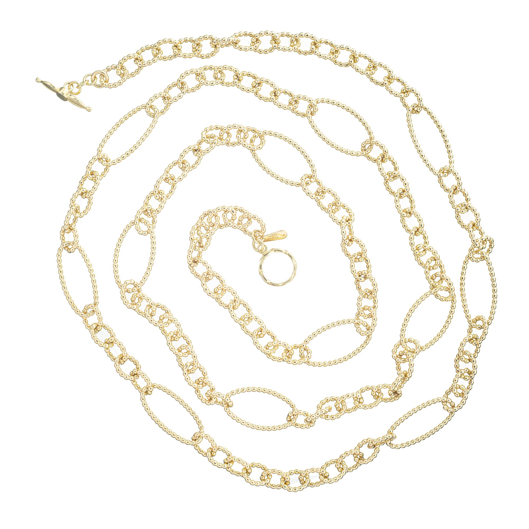 Custom made 36 inches long, 18k Yellow Gold Beaded Style Link Necklace. The beaded corrugated style links create a captivating pattern that adds a touch of style. The small oval links alternate with large oval links. Each link is carefully crafted