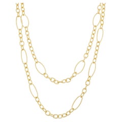 Collier à maillons ondulés en or jaune 18k et perles 