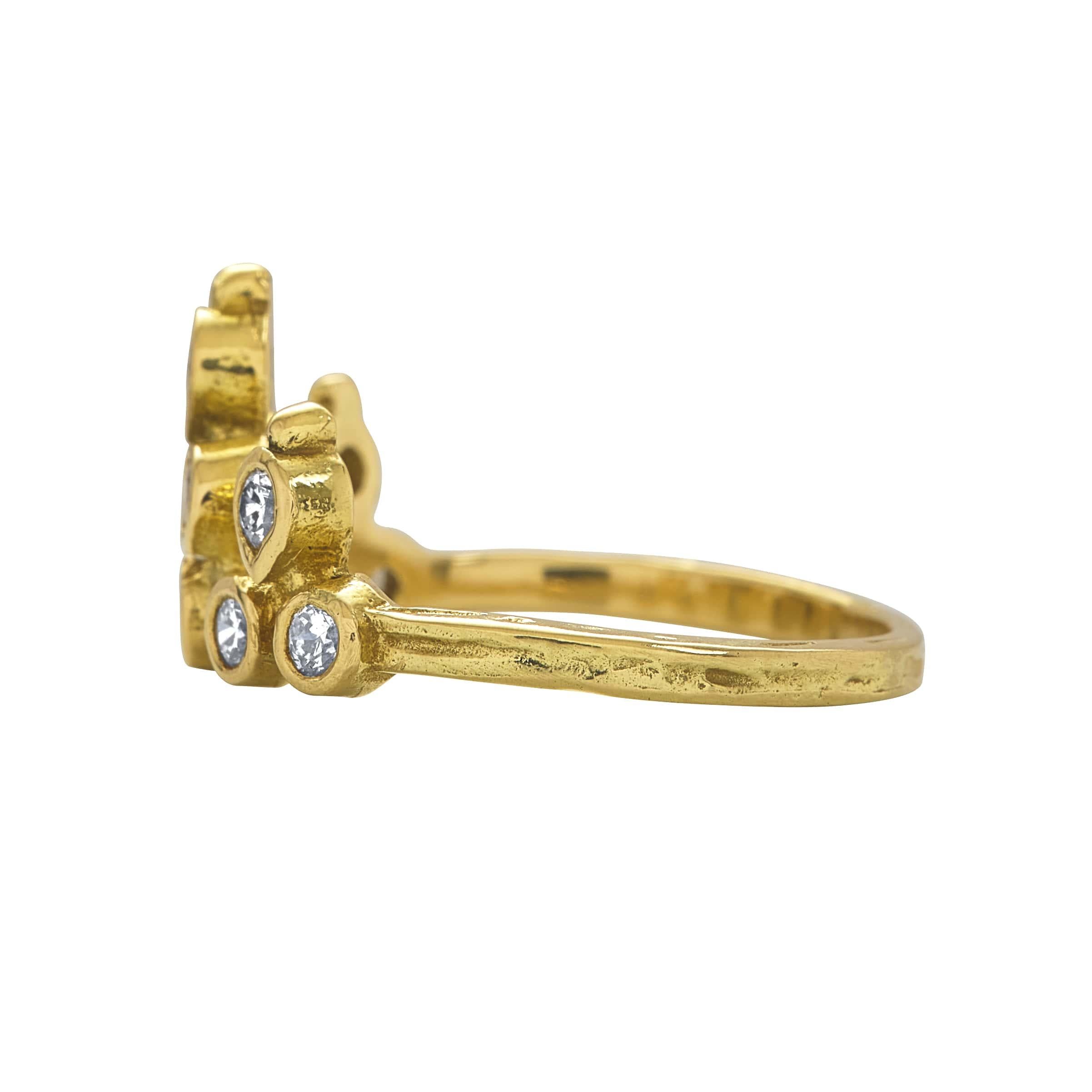 A symbol that you are the ruler of your own world, an 18k yellow gold tiara-like shape is formed by 10 bezel-set brilliant-cut colorless diamonds. This unique ring can be worn alone or in a stack, and in either direction on the finger. It makes the