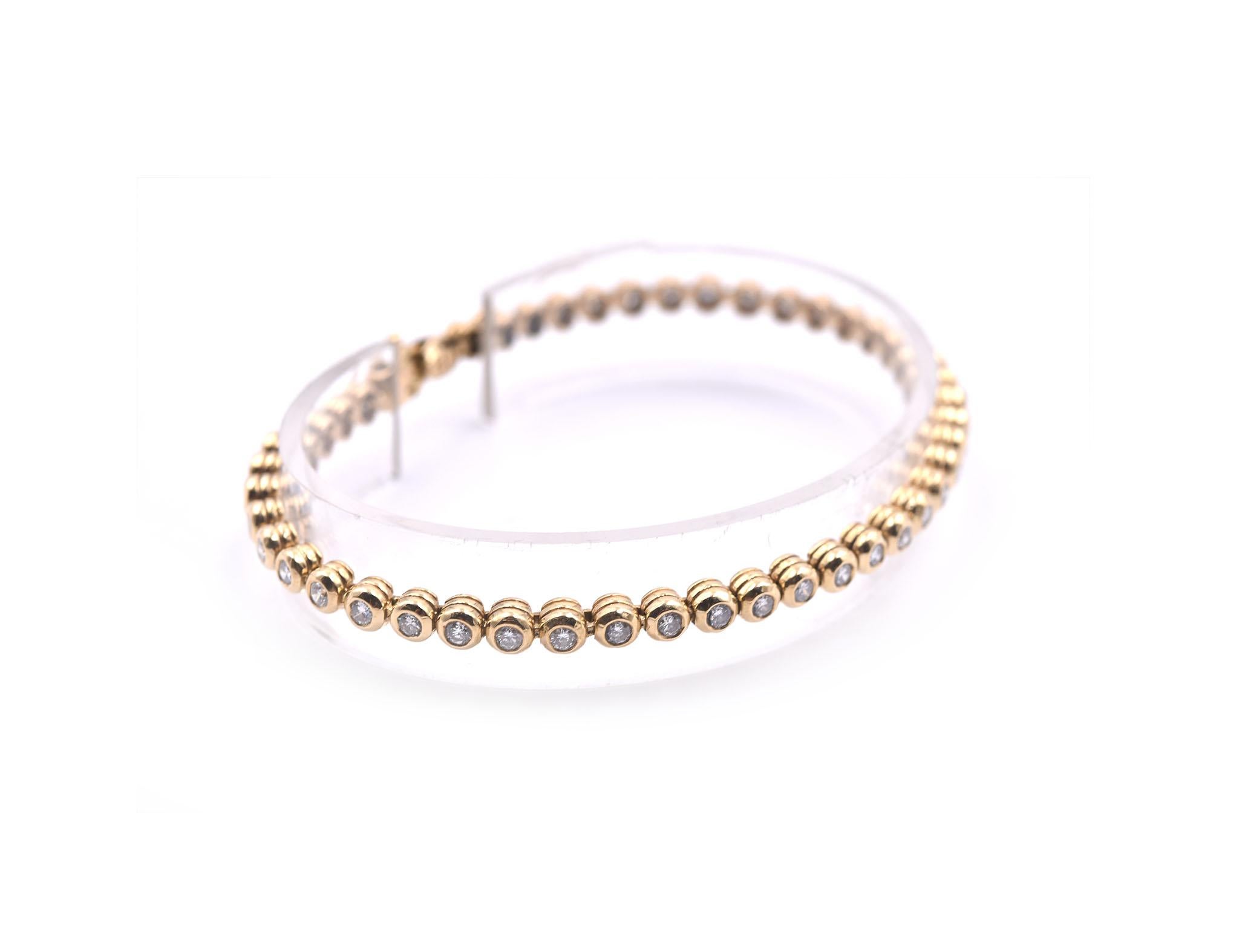 Designer: custom design
Material: 14k yellow gold
Diamonds: 40 round brilliant cut = 1.84cttw
Color: G
Clarity: VS
Dimensions: bracelet is 7-inch long and it is 4mm wide
Weight: 15.87 grams