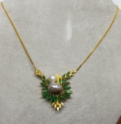 18 Karat Yellow Gold "Bird" Shaped Pearl with Emeralds and Diamonds Pendant