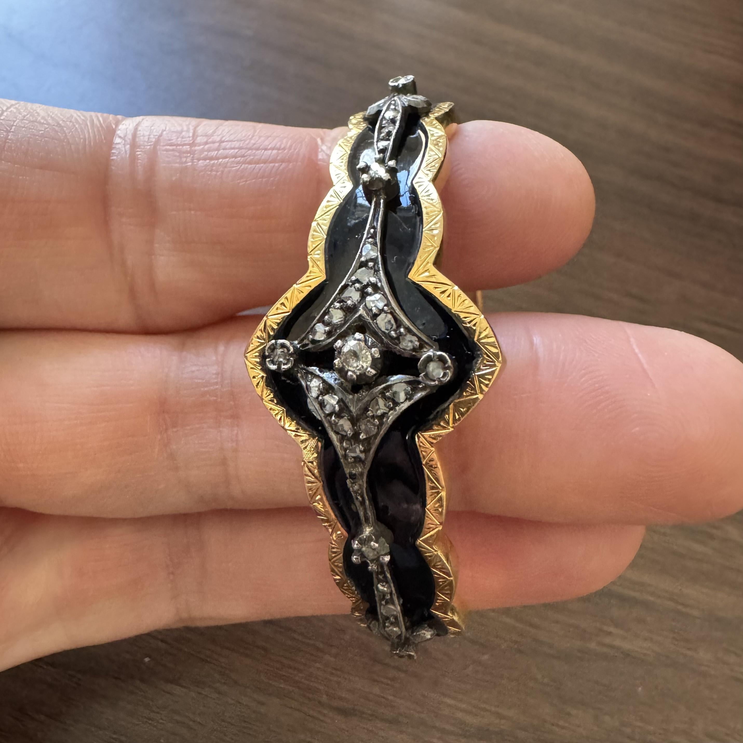 Condition:  Very Good Condition
Metal:  18k Gold (Marked, and Professionally Tested)
Weight:  24.8g
Diamonds:  Old Cut Diamonds 0.35cttw
Length:  6.5 Inches Inner Circumference
Width:  22mm at widest, 7.5mm at narrowest
Closure:  Box Tab Insert with
