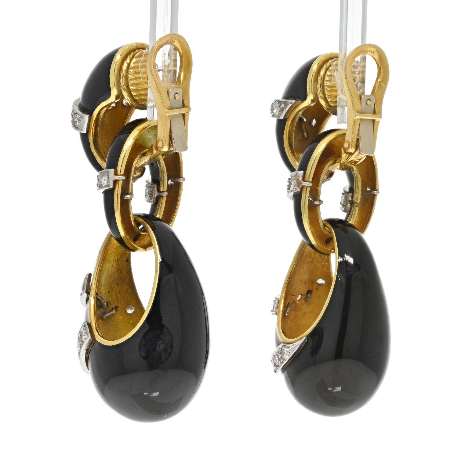 Lovely and chic these earrings are very French chic looking. Made in 18K Yellow gold, designed as a dangling bombe with black enameling and diamonds all over the surface. 
With clip backings. 
Length: 6cm.