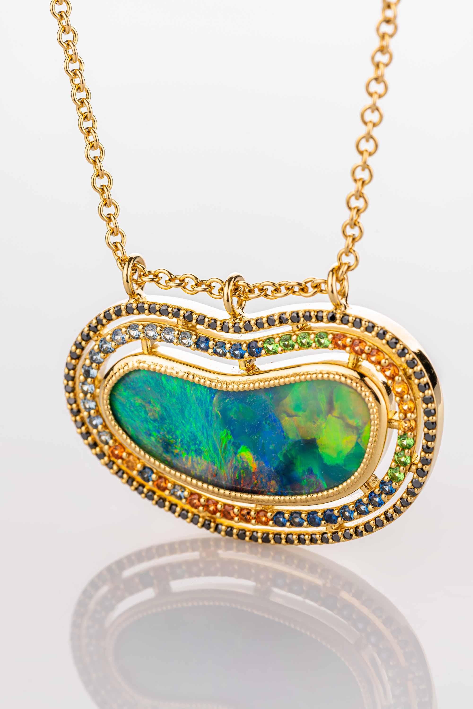 Round Cut 18 Karat Yellow Gold Black Opal Necklace with Diamond, Garnet, and Sapphire Halo