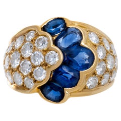 Ring aus 18 Karat Gelbgold mit blauem Saphir und Diamanten