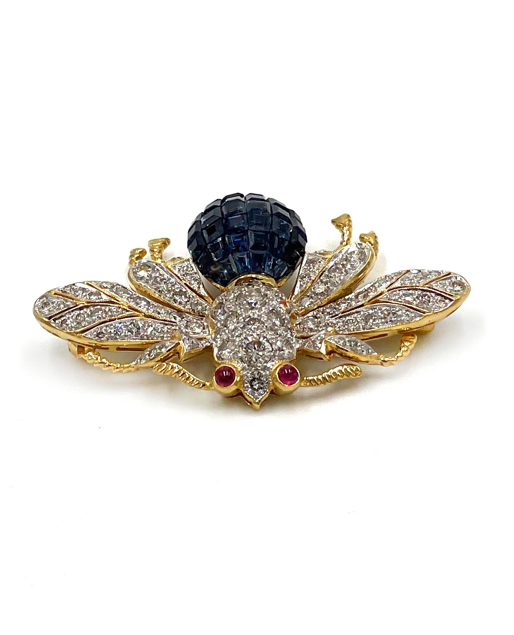 Pre owned vintage estate 18K yellow gold deep intense blue sapphire bee pin.  The body of the bee has 39 invisibly set square cut blue sapphires with an approximate total weight of 4.50 carats.  Set on both wings and body are a total of 92 round