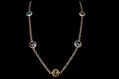 18 Karat Yellow Gold Blue Topaz, Amethyst, and Prasiolite Station Necklace