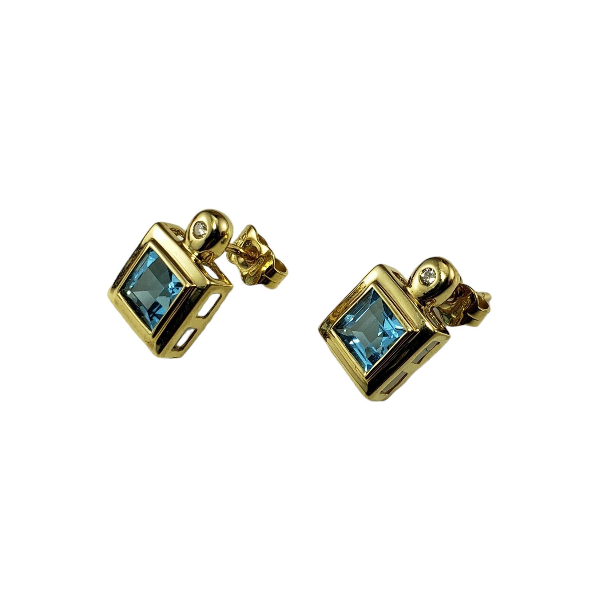 Vintage 18K Yellow Gold Blue Topaz and Diamond Earrings JAGi Certified-

These stunning earrings each feature one square blue topaz and one round brilliant cut diamond set in classic 14K yellow gold. 

 Push back closures.

Total topaz weight:  1.82