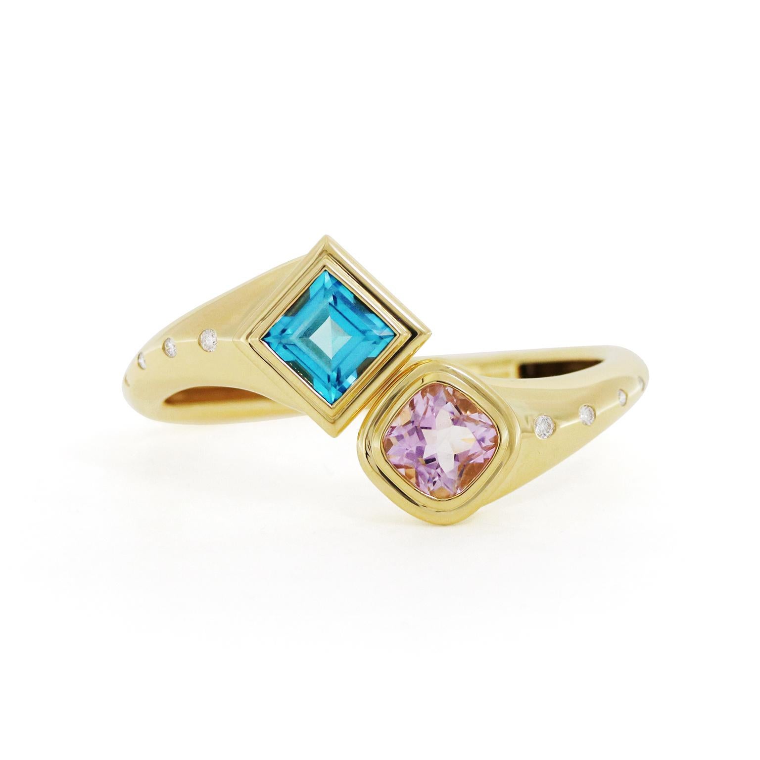 A graceful harmony of blue topaz and kunzite is the focus of this 18k yellow-gold bangle bracelet. One end features a square cushion blue topaz, accentuating a glimmering array of cool tones. On the opposite end is a cushion kunzite, emitting flecks