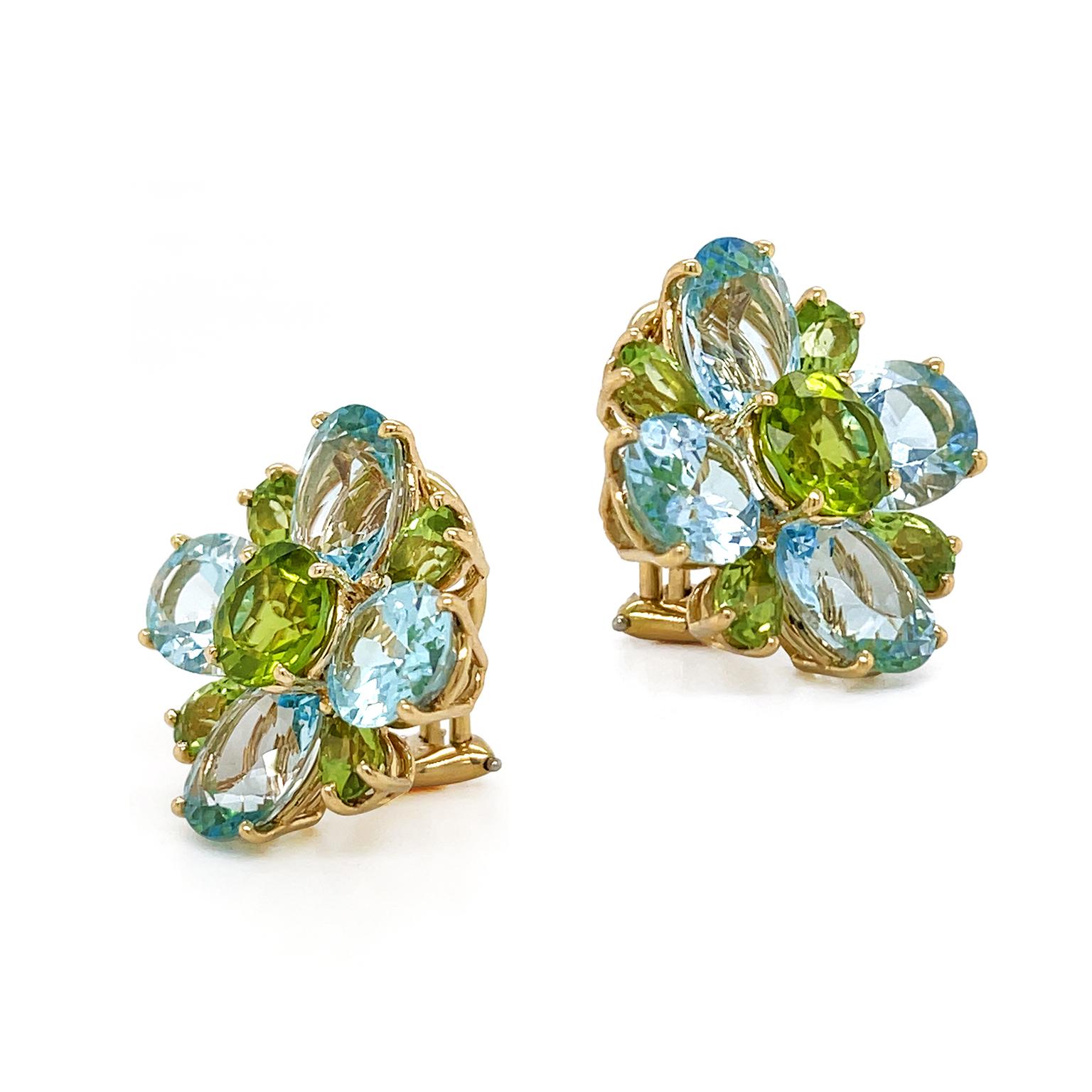 Serene complementing hues of blue topaz and peridot are the focus of these earrings. A sparkling round peridot with a light and olive-green hue is the heart of the motif enhanced with 4 brilliant oval blue topaz. In between each blue topaz is a