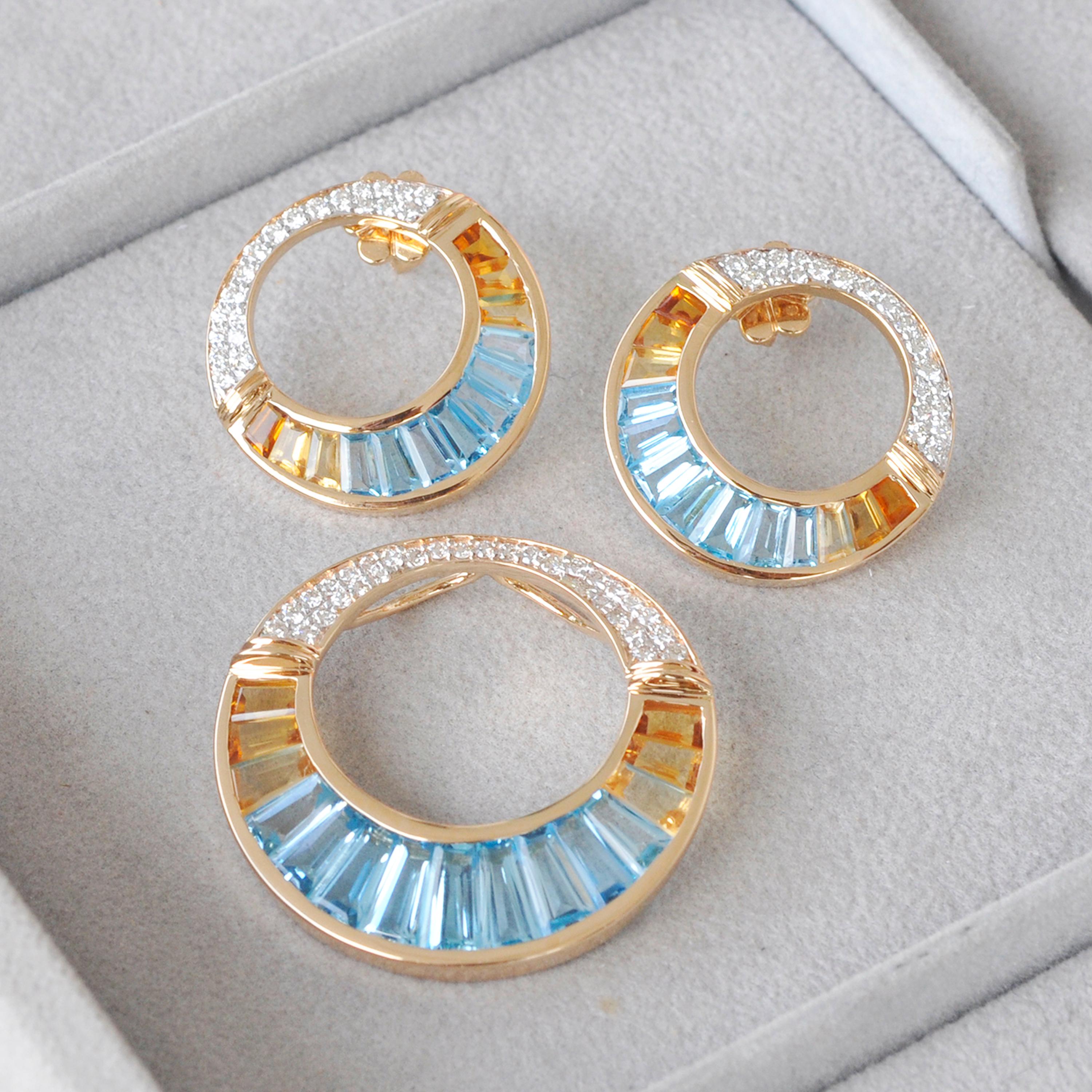 18 karat yellow gold swiss blue topaz citrine baguette diamond pendant brooch earrings set

This set of 18 karat yellow gold blue topaz citrine baguette and diamond circular pendant / brooch and earrings is inspired by the jewels worn by Cleopatra