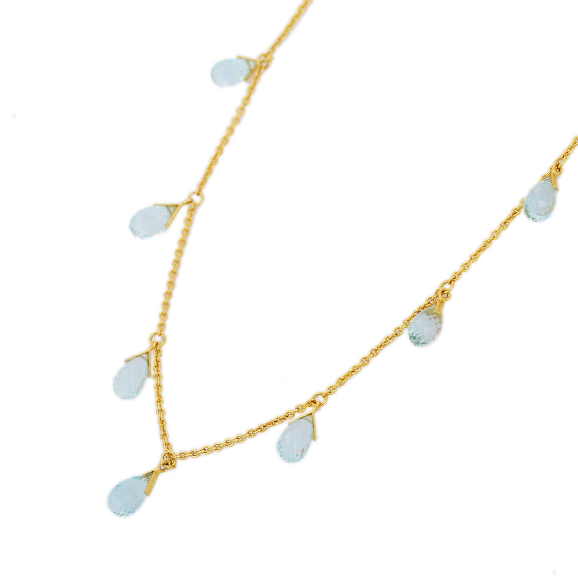 Blue Topaz Necklace in 18K Gold studded with drop cut topaz pieces.
Accessorize your look with this elegant blue topaz drop necklace. This stunning piece of jewelry instantly elevates a casual look or dressy outfit. Comfortable and easy to wear, it