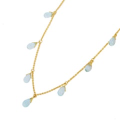 Collana con catena a frange con goccia di topazio blu in oro giallo massiccio 18 carati