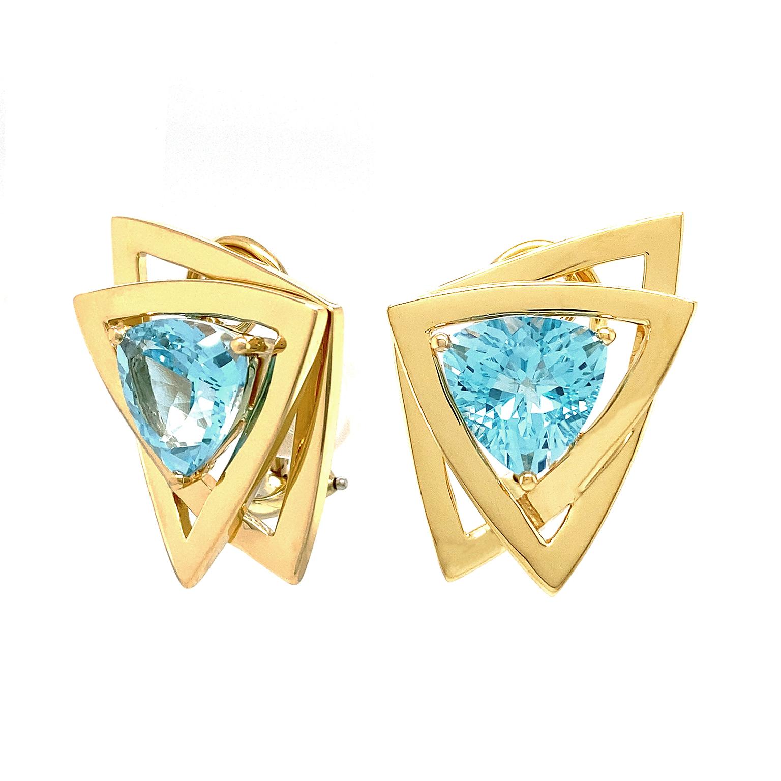 Glistening Blue Topaz is accentuated by 18k yellow gold frames for these earrings. The gem emits a shimmering light in all directions as 18k yellow-gold round prongs secure it. Openwork 18k yellow gold trillions link asymmetrically to further