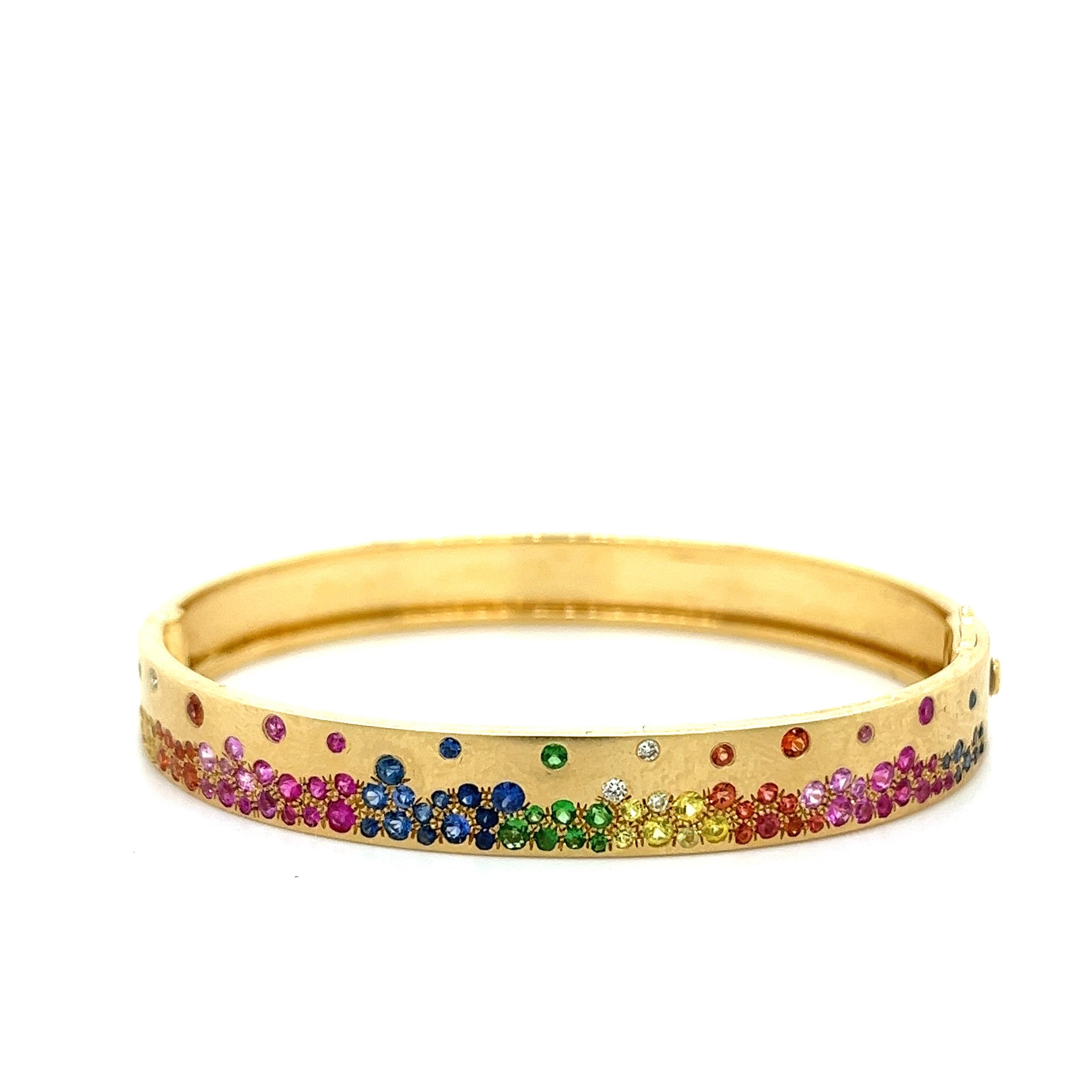 18K Yellow Gold Bracelet with Multi-Color
Gemstones and Diamonds

23 Blue Sapphires - 0.48 CT
5 Diamonds - 0.06 CT
8 Green Garnets - 0.16 CT 
18 Orange Sapphires - 0.40 CT
33 Pink Sapphires - 0.76 CT
13 Yellow Sapphires - 0.32 CT
18K Yellow Gold -