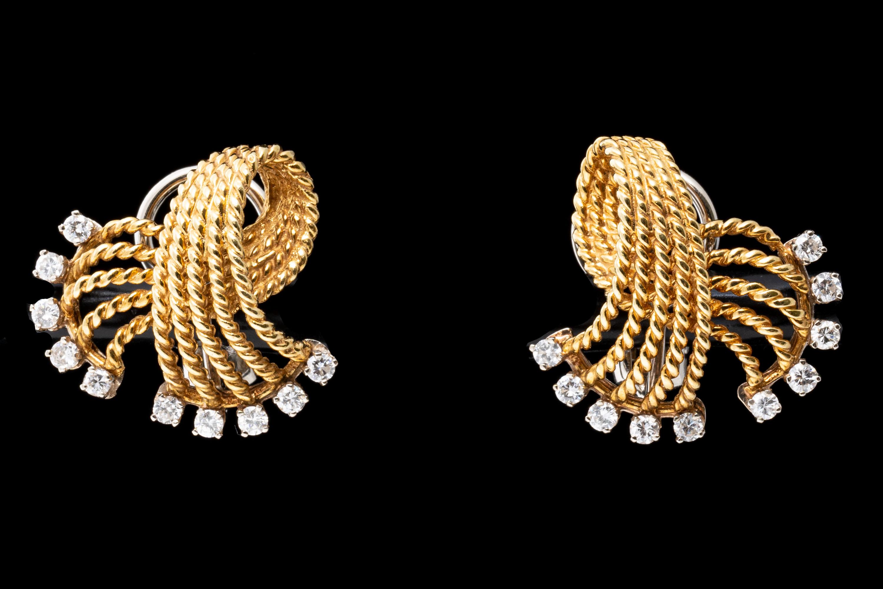 Yellow gold earrings. These classic earrings are a stylish, five row braided fold over knot, decorated on the ends with round faceted, prong set diamonds, approximately 0.50 TCW. The earrings have omega style backs, with no posts.
Marks: None,