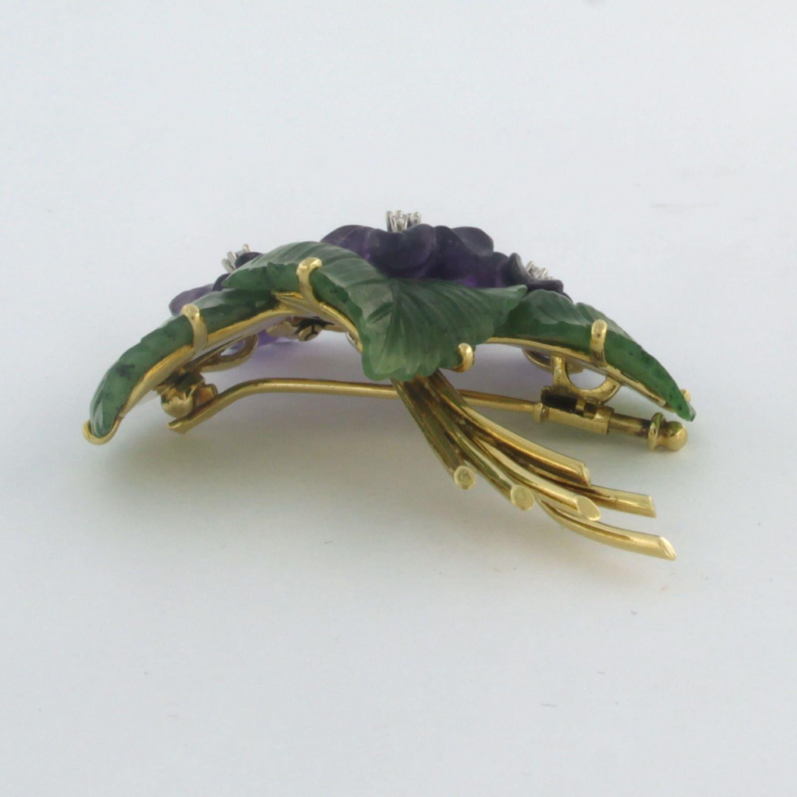 18k yellow gold brooch in the shape of a bouquet with amethyst, jade and single cut diamond. 0.08ct - F/G - VS/SI - dim. 6.2cm x 4.5cm

detailed description

the size of the brooch is 6.2 cm wide by 4.5 cm high and 1.3 cm deep

weight 21.5