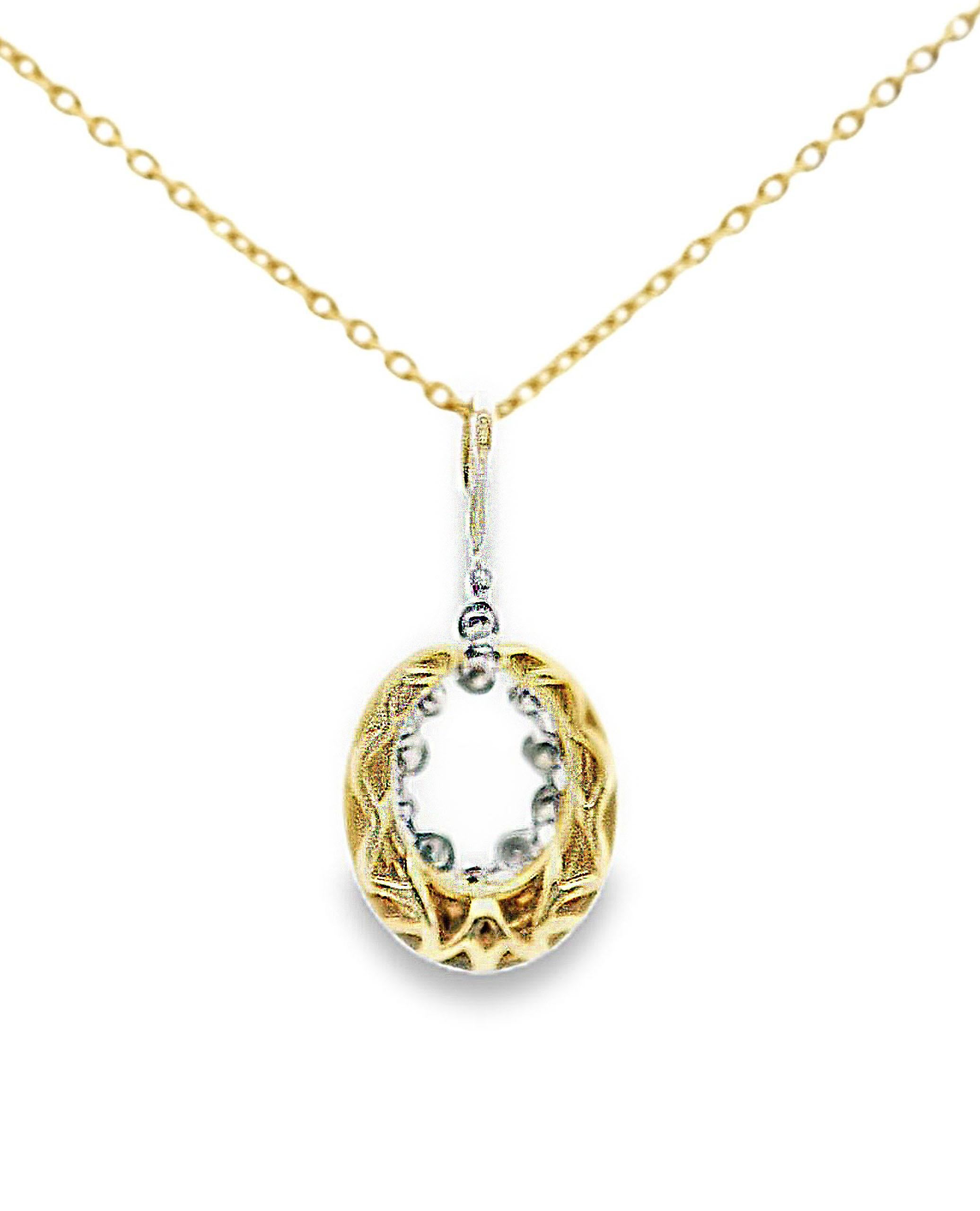 18K yellow gold Vanna K pendant with satin finish and black rhodium.  The pendant is furnished with round faceted white diamonds weighing a total of 0.03 carats and round faceted brown diamonds totaling 0.34 carats.

- The pendant slides on a 18K