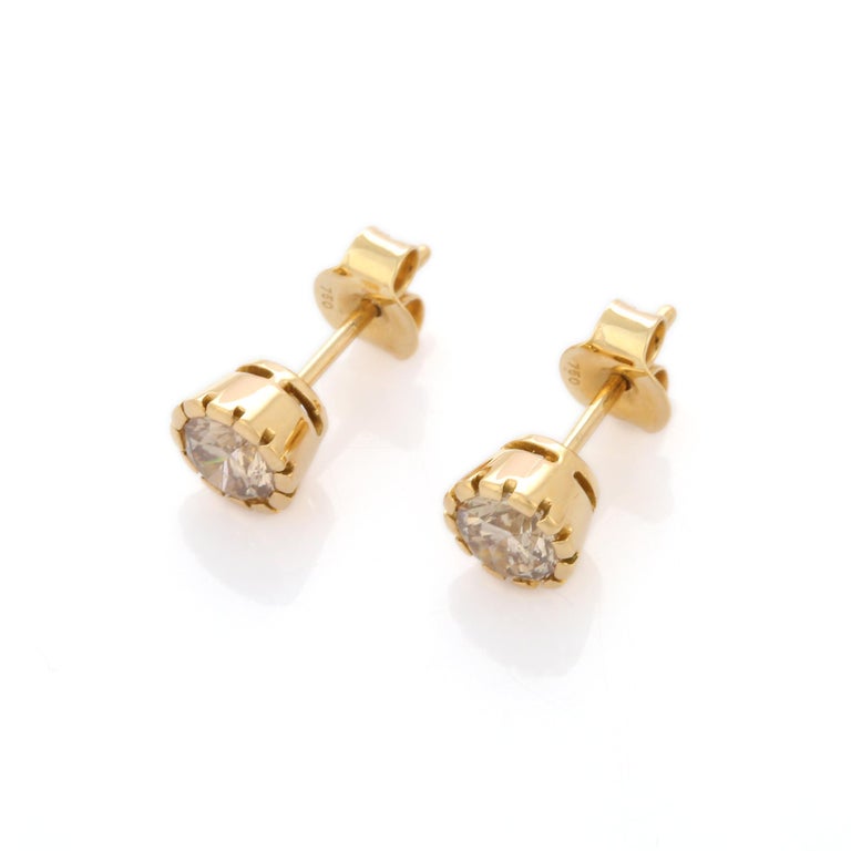 Studs create a subtle beauty while showcasing the colors of the natural precious gemstones and illuminating diamonds making a statement.

Round cut brown diamond in 18K gold. Embrace your look with these stunning pair of earrings suitable for any