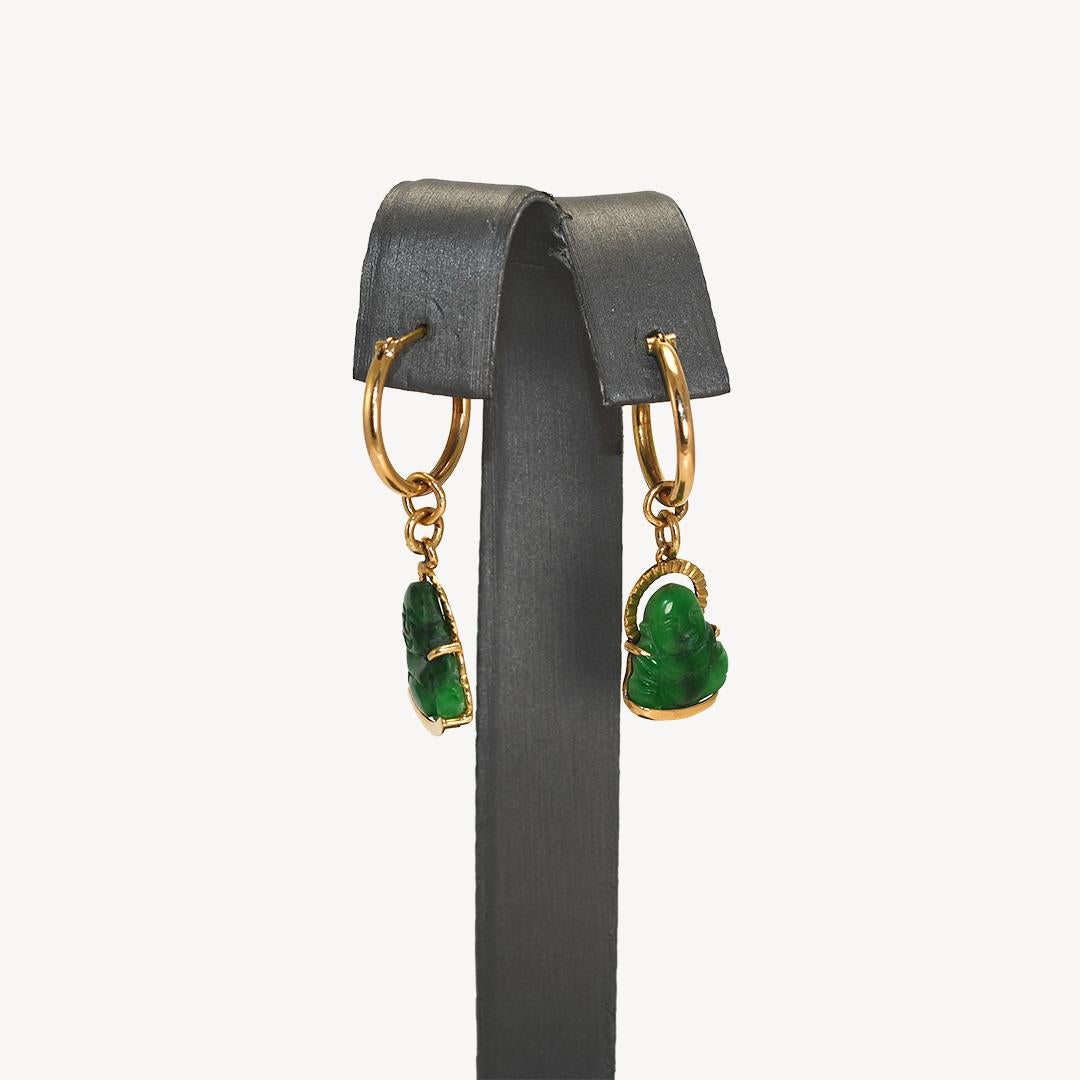  Buddha green jade dangle earrings with 18k yellow gold settings.
The settings test 18k and the gross weight is 4.2 grams.
The Buddha figurines in the gold setting measure 1/2 inch long.
The whole earring measures 1 1/4 inches long.
Excellent