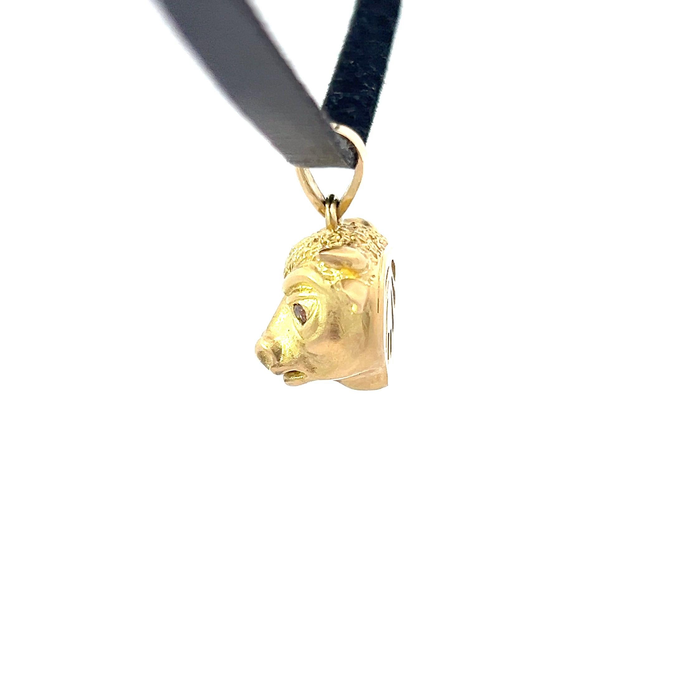 Ignite your style with our striking 18k Yellow Gold Bull Pendant featuring captivating bronze diamond eyes. Meticulously crafted, this pendant exudes strength and resilience, embodying the spirit of the bull. The bold design captures the essence of