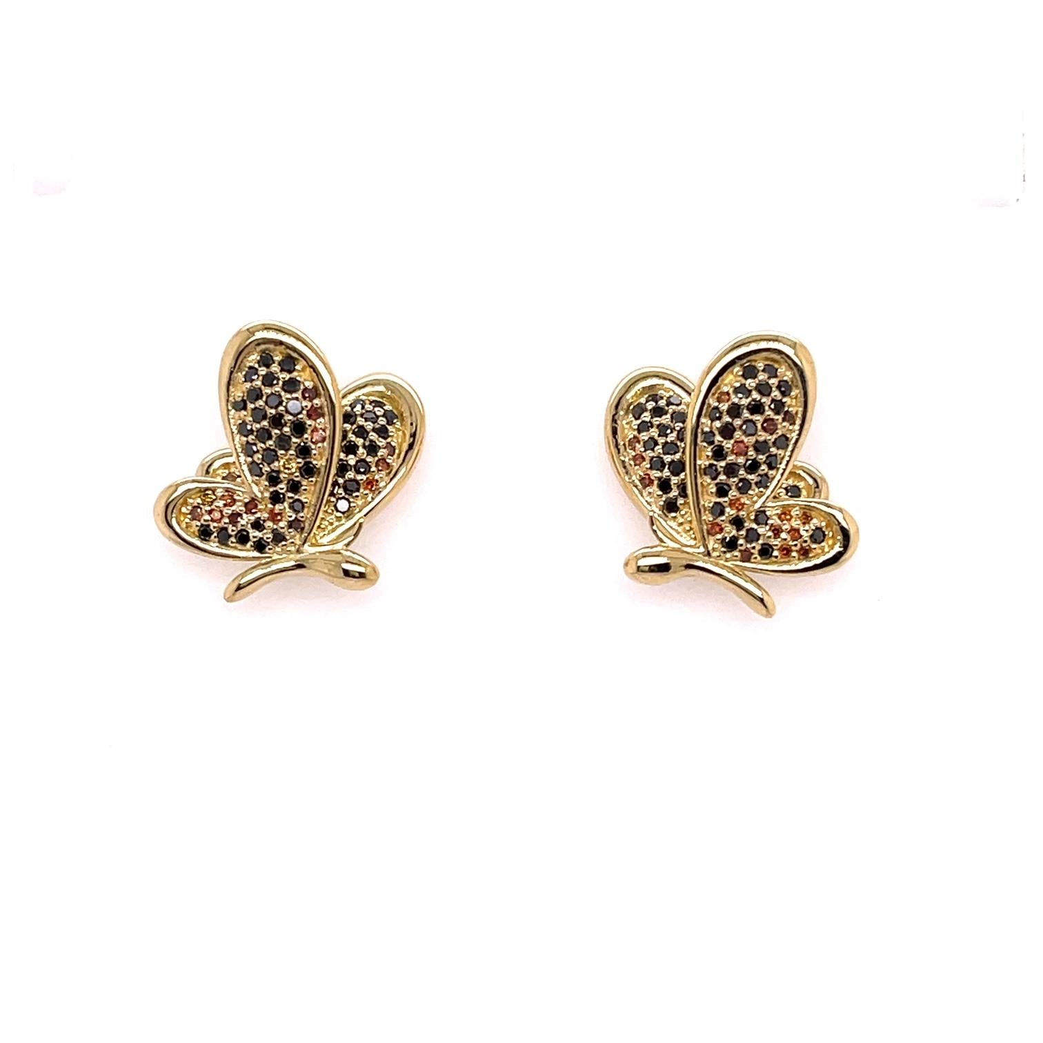 A pair of 18k yellow gold butterfly studs set with .55carats of black and sherry colored diamonds and a pair of 18k yellow gold jackets, set with two 4mm Spessertite garnets, .7 carats, three 3.5mm yellow sapphires, and one 3mm orange sapphires, .84