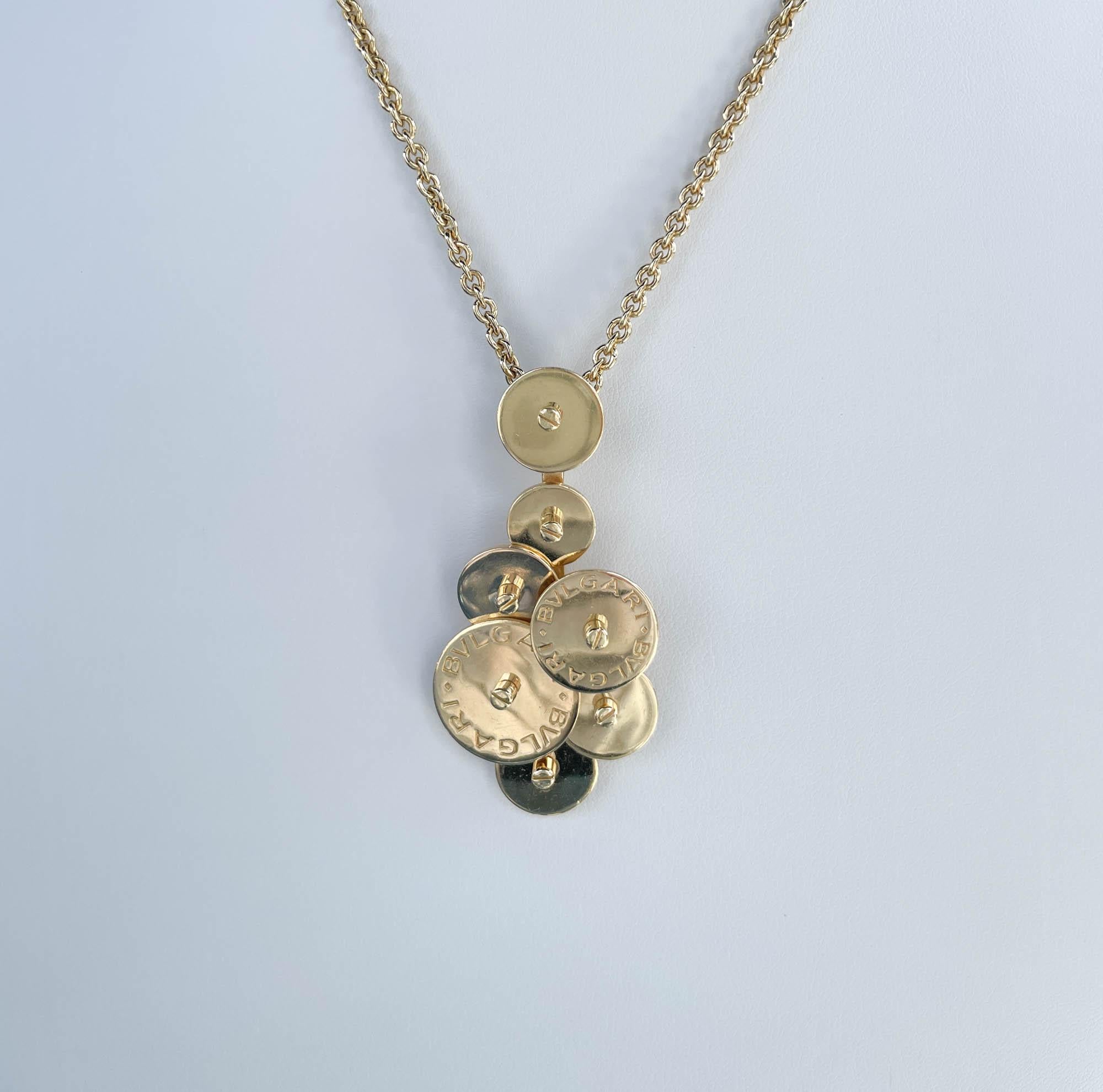 Jay Feder 18k Yellow Gold BVLGARI CICLADI Pendant Necklace
The necklace is 23-24-25 inches long (with bead extensions).
The pendant measures to 55x22mm.
The total weight of the necklace is 35.4 grams.

Please view our photos and videos for more
