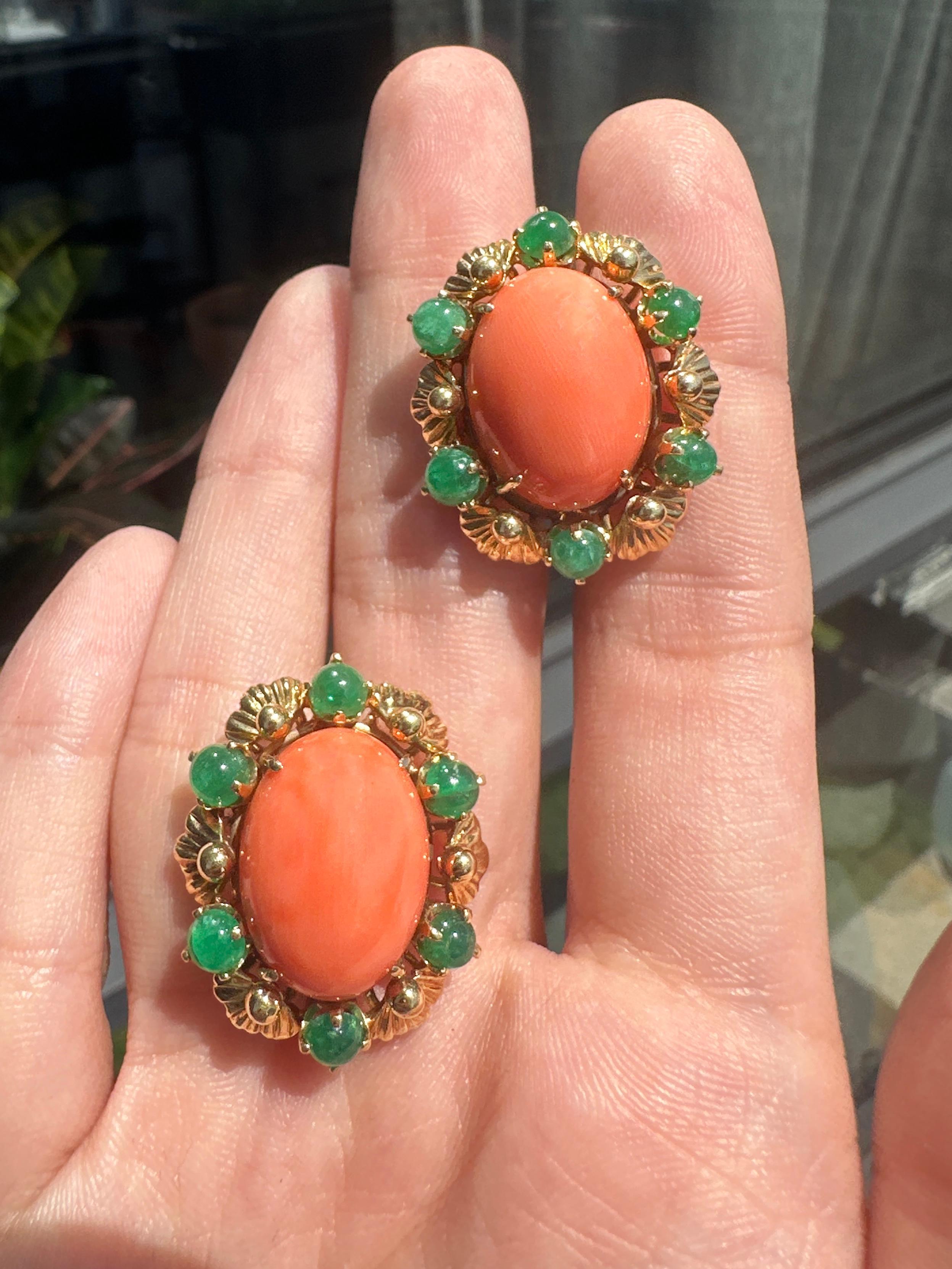 Elevate your jewelry collection with these stunning 18k Yellow Gold Cabochon Orange Stone and Emerald Earrings. Crafted from 18k yellow gold, these earrings feature a beautiful cabochon orange stone and approximately 2.50 carats of emeralds. With a