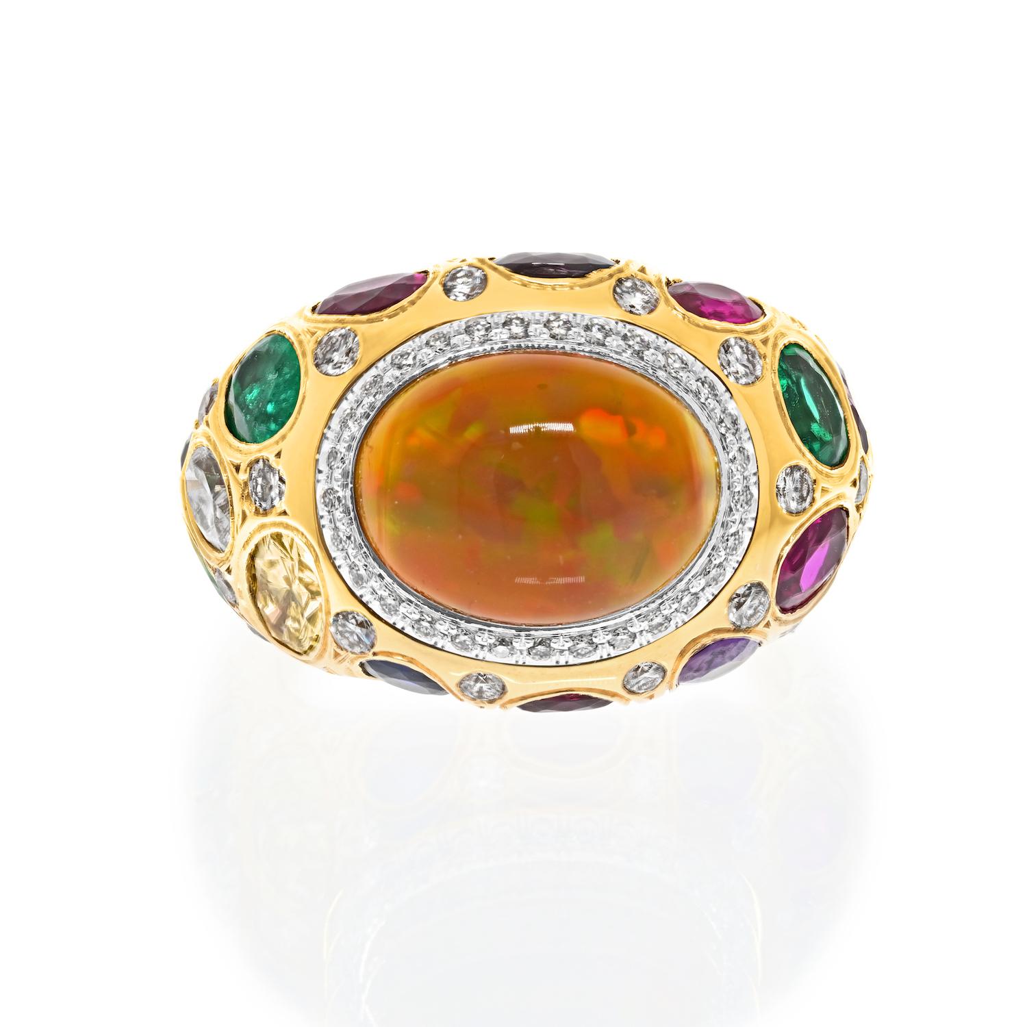 The Fire Opal Elegance: A Handmade Masterpiece.

This is a one-of-a-kind fire opal ring, lovingly crafted with a natural cabochon oval-cut fire opal. Set in 18k yellow gold, this bombe-style ring offers a delightful twist with a platinum rim bezel,