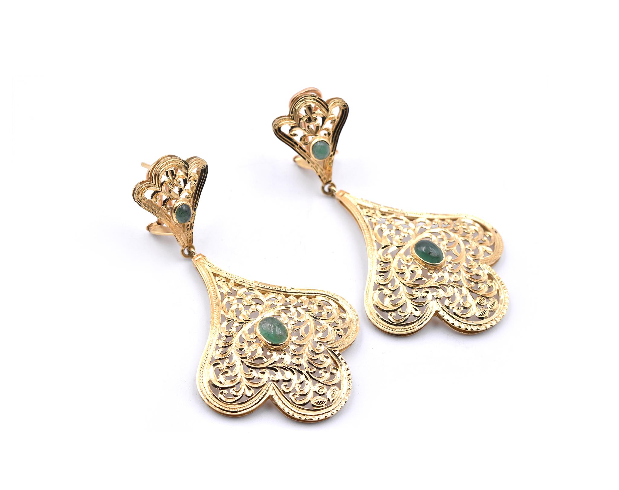 Designer: custom design
Material: 18k yellow gold
Gemstone: 4 cabochon cut jades 
Dimensions: earrings measure 77.70mm x 41.50mm
Fastenings: post with omega backs
Weight: 24.6 grams
