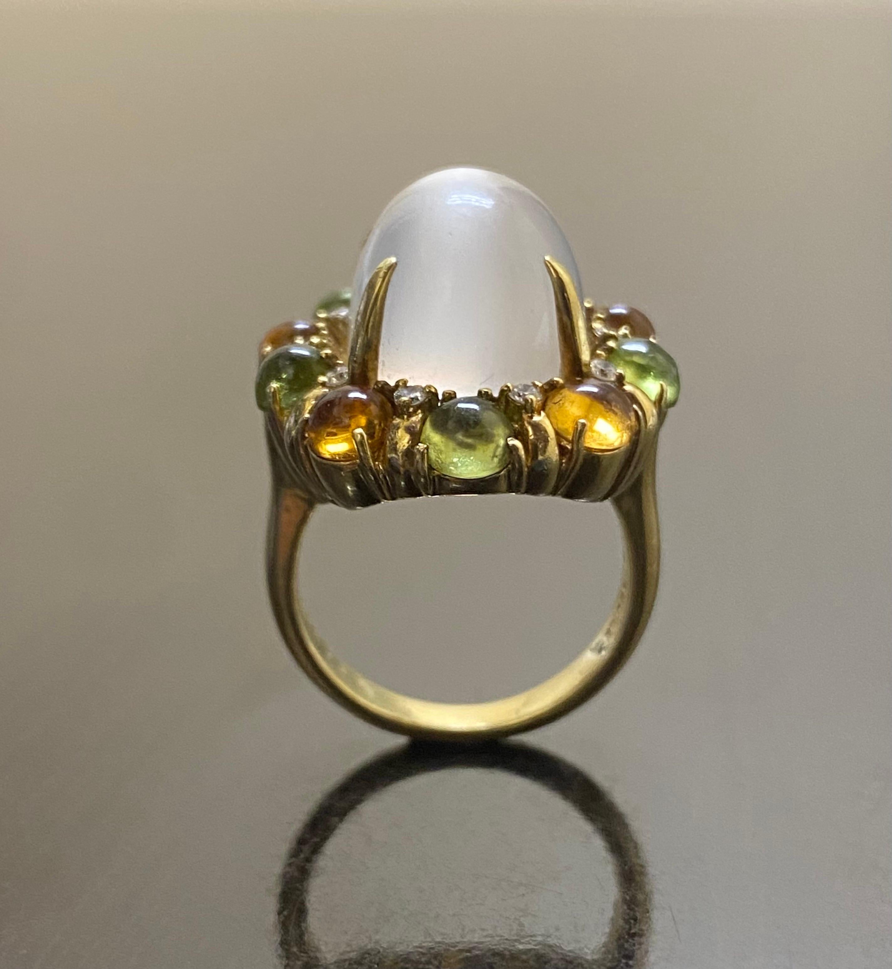 DeKara Designs Collection

Art Deco Inspired Extremely Elegant Handmade Cabochon Citrine and Cabochon Peridot Diamond Moonstone Engagement Ring.

Metal- 18K Yellow Gold, .750.

Stones- 1 Genuine Oval Cabochon Moonstone 13.30 Carats, 5 Round Cabochon