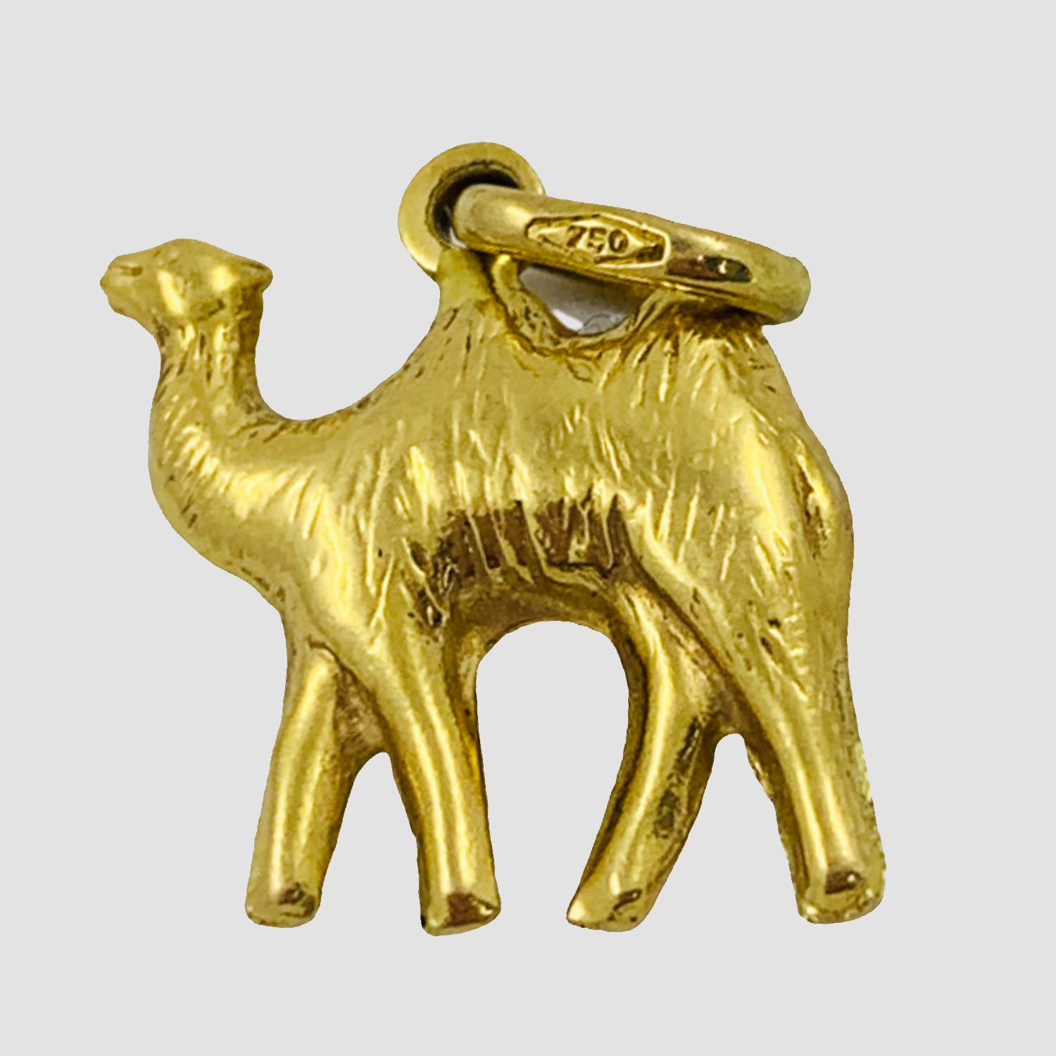 Vintage Golden Camel Charm circa 1930-40's

Crafted of 18K yellow gold, this little camel would make such a cute addition to any charm bracelet or necklace. The charm features a dromedary camel with a jump ring to easily add to your charm bracelet