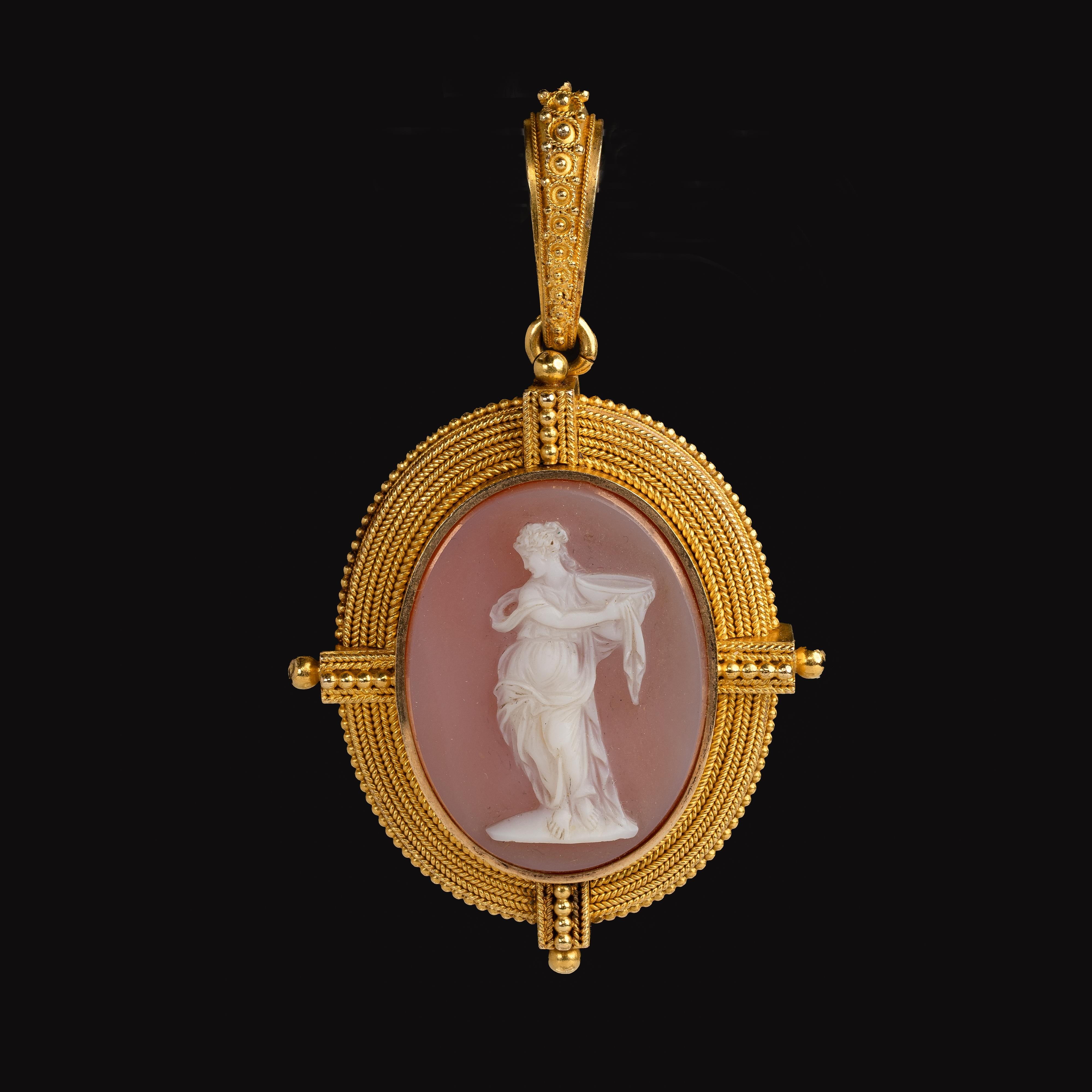 Material: 18k Yellow Gold
Gemstone: Shell
Weight: 26.66 grams
Dimensions: 2 5/8 inches x 1 6/8 inches
Time period of origin: 1880's

Beautiful antique Victorian cameo pendant that features a carved cameo depicting a Grecian figure set in a luxurious