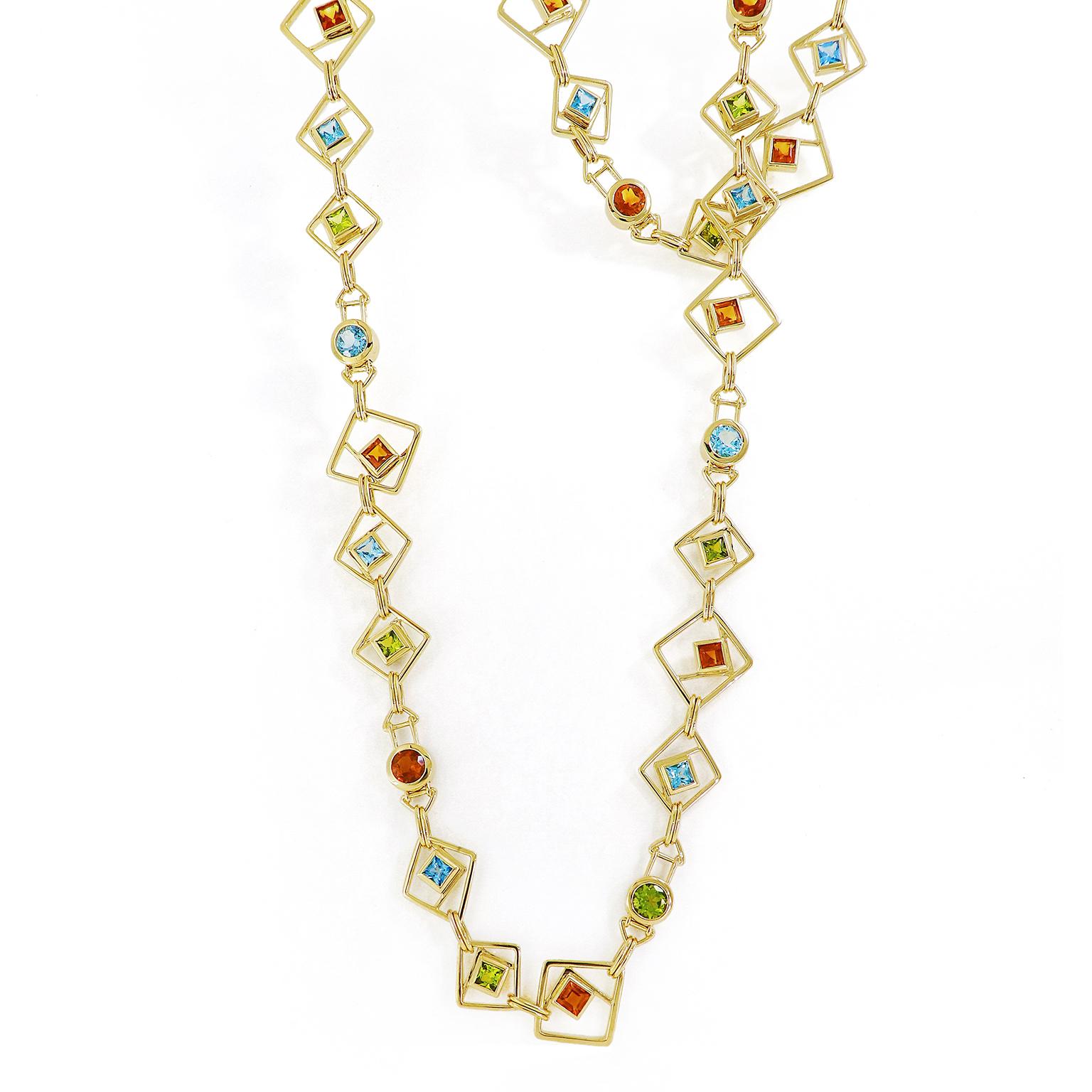 Peridot, blue topaz, and citrine form a harmonizing trio of colors as they glisten alongside rich 18k yellow gold. Geometric shapes add interest to the pattern of this necklace. The design features 18k yellow gold wires forming three squares turned