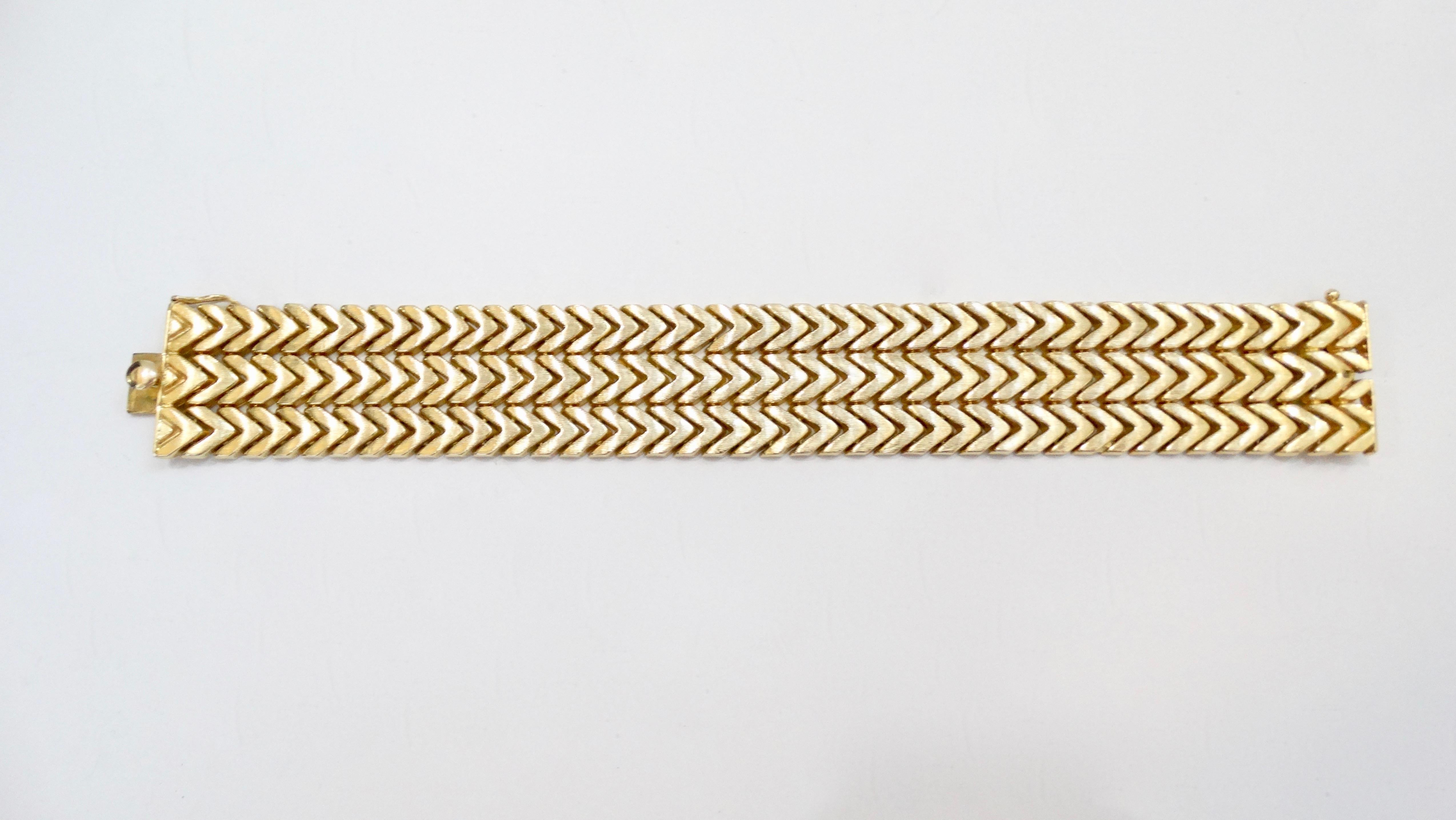 Gorgeous 18k Yellow Gold bracelet with a 3 row chevron design, box clasp closure and security clip. Stamped 750 and total weight in grams is 52. Perfect for layering or wearing alone! 