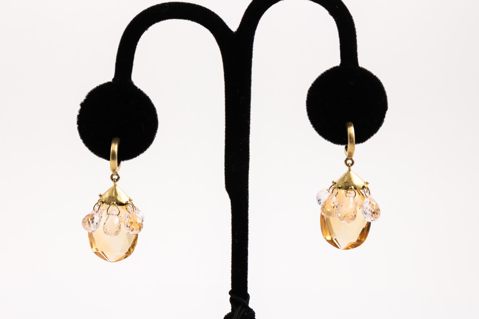 Hand crafted in solid 18 Karat yellow gold, the earrings have large citrine drops that measure about 3/4 inches. Hanging from the cap of each of the Citrine stone, are 6 multi faceted kunzite tear drops. Each about 8 mm long and 5 mm wide. Total 1