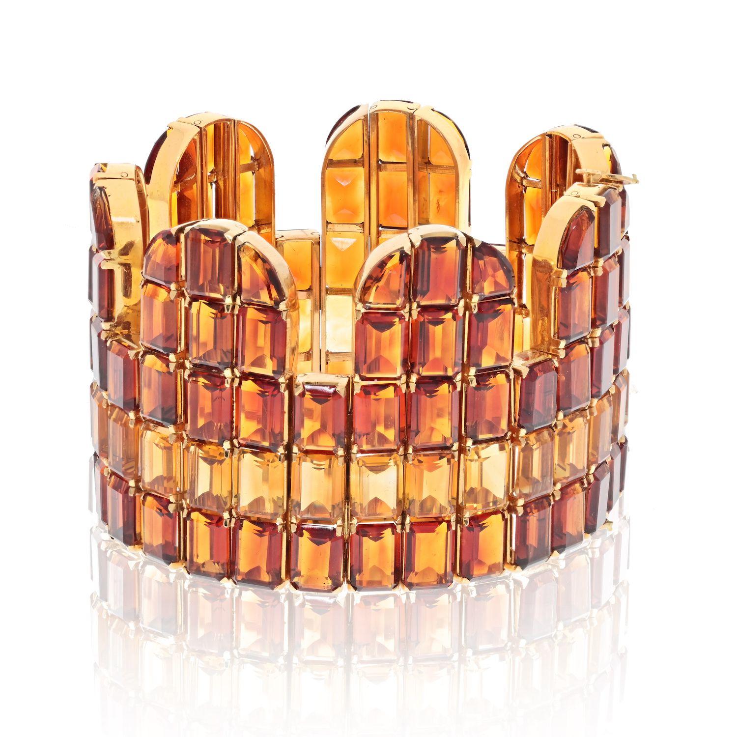 The natural 18K yellow gold citrine and topaz multi-row bracelet is a stunning piece of jewelry that is sure to turn heads. Crafted from high-quality 18-karat yellow gold, the bracelet features several rows of beautiful citrine and topaz gemstones