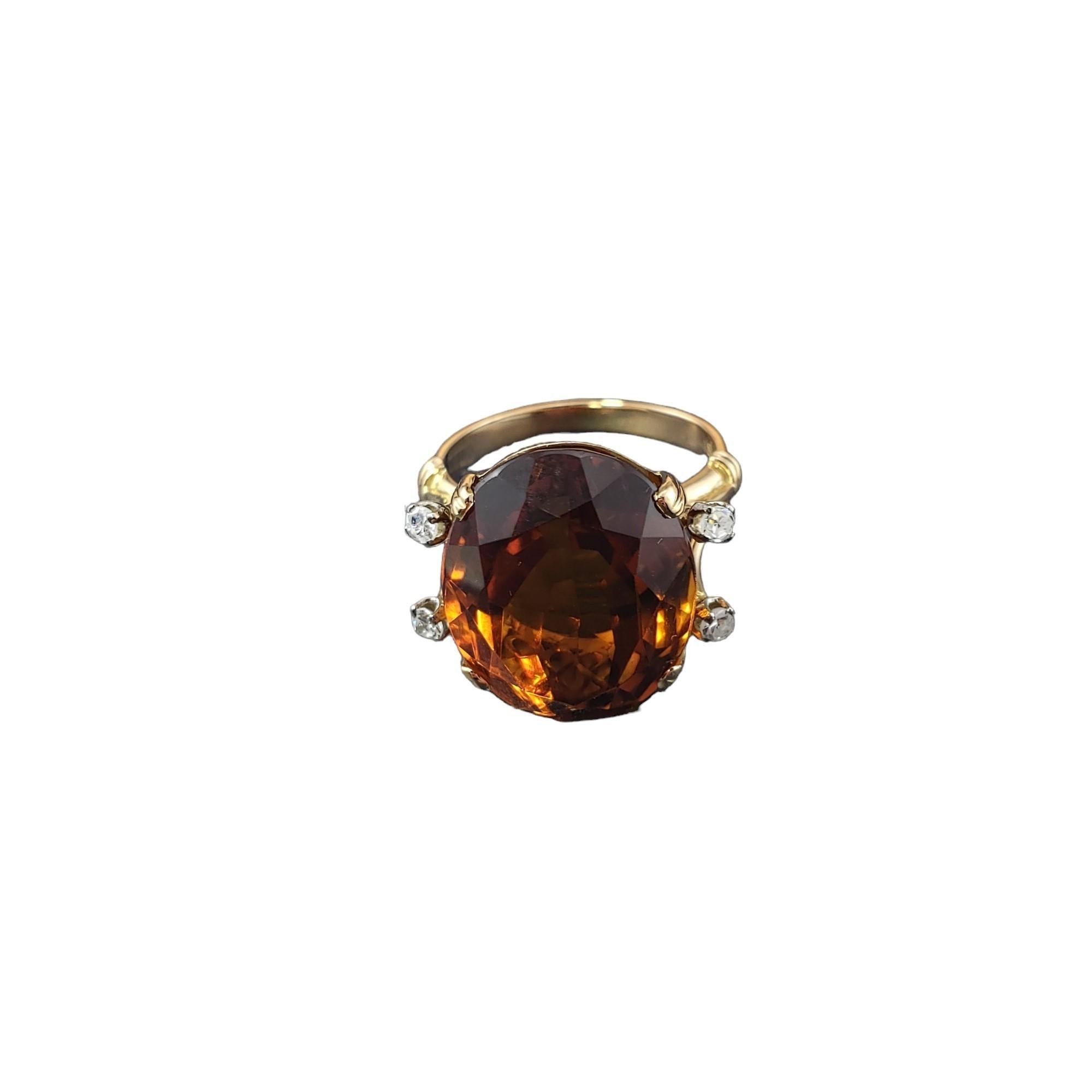 18K Yellow Gold Citrine and Diamond Ring Size 5.25 JAGi Certified-

This stunning ring features one oval citrine quartz stone (16 mm x 13.5 mm) and four round single cut diamonds set in 18K yellow gold.  

Shank: 2 mm.

Citrine weight: 11.82