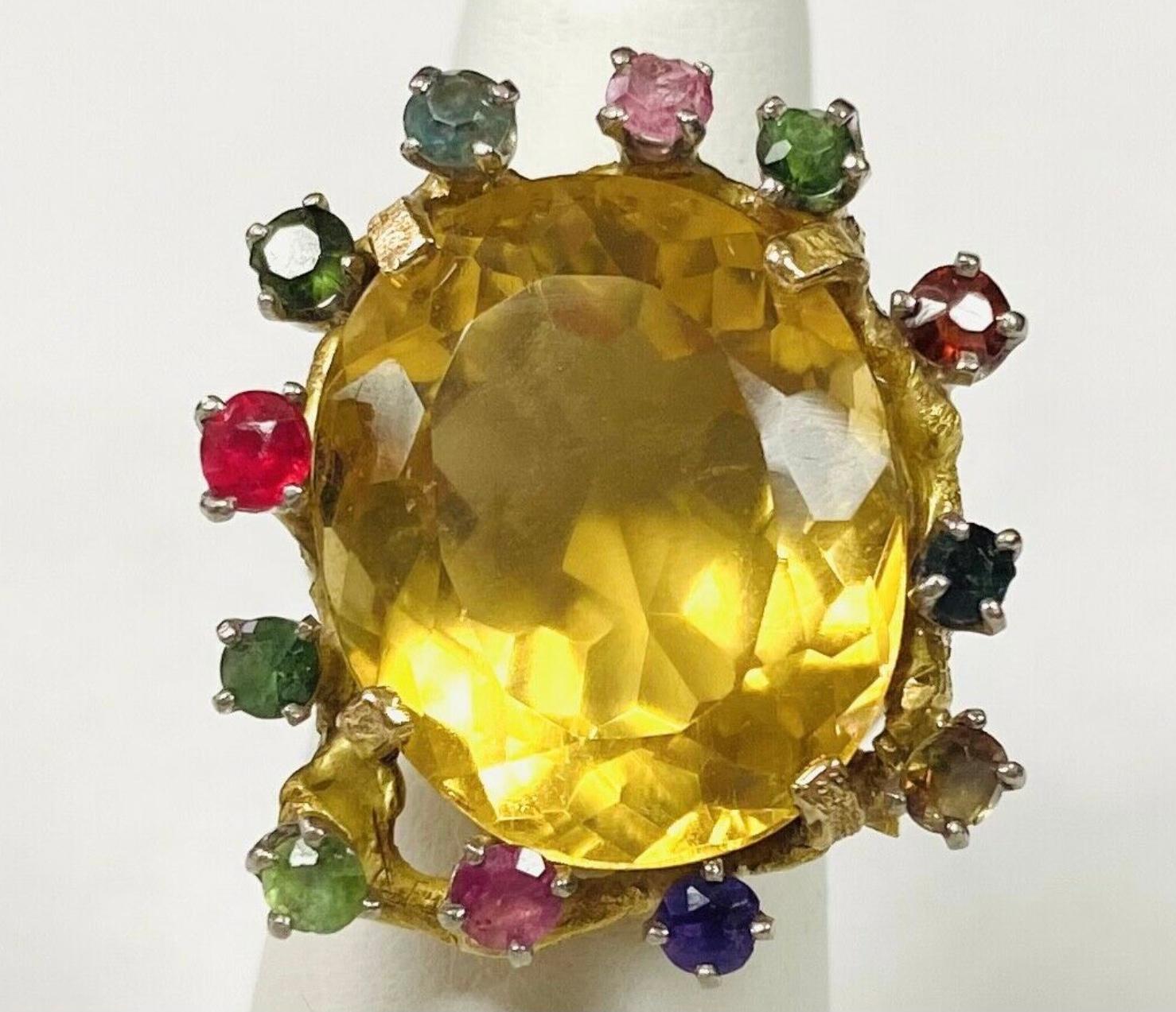 18k yellow gold Citrine and diamond ring, The dimensions of the oval Citrine are approximately 30 mm x 15 mm. Approximately 12 carats. 18K tested. Approximate size 6.5.
