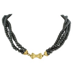 18k yellow gold clasp on a hematite bead necklace - 40 cm long