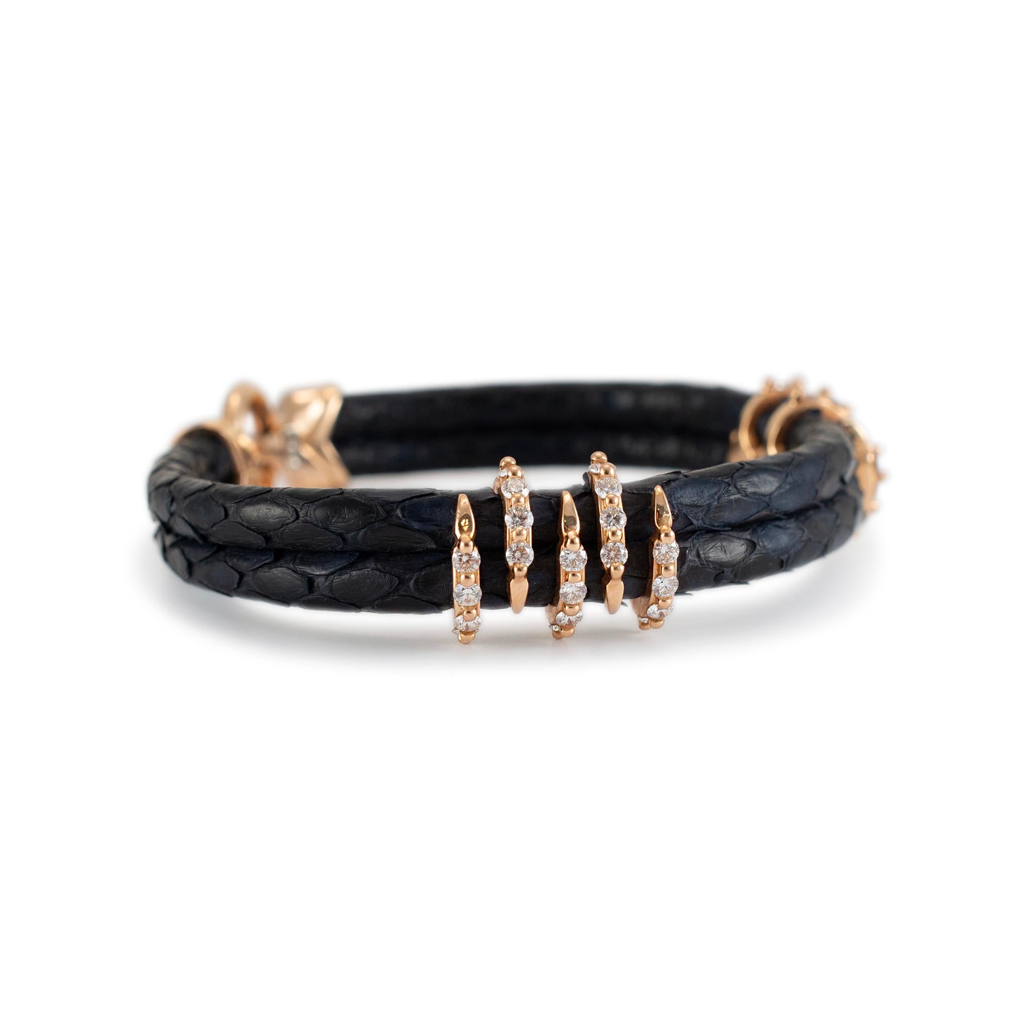 Metal Type: 18K Yellow Gold

Length: 6.75 inches

Width: 11.20 mm  

Weight: 24.56 grams

18K yellow gold diamond bangle bracelet. The metal was tested and determined to be 18K yellow gold. Engraved with 