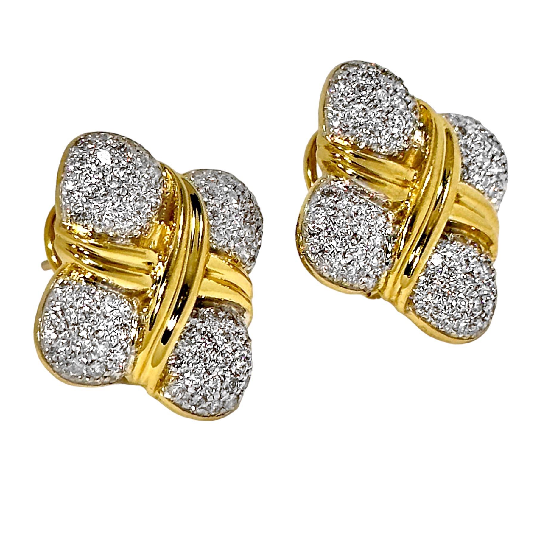This vintage pair of 18k yellow gold and diamond, clover motif earrings is absolutely scintillating. Over 100 brilliant cut diamonds, with a total approximate weight of 3.85ct are set  edge to edge in white rhodium covered plates. Overall diamond