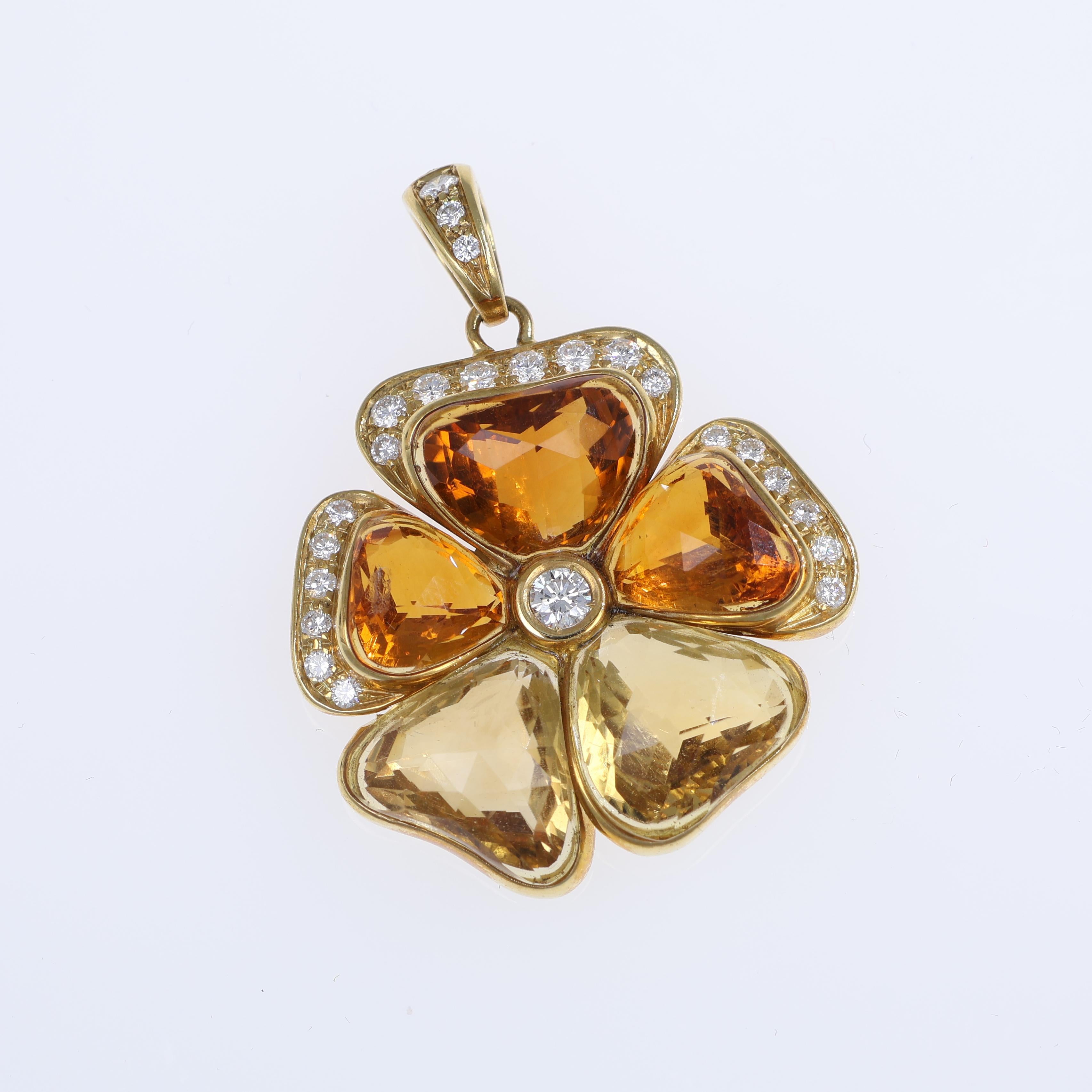 This exquisite 18K yellow gold pendant is designed as a lucky four-leaf clover, adorned with vibrant citrine gemstones totaling 3.90 carats. Each petal is outlined with brilliant-cut natural diamonds, adding a touch of sparkle and elegance. A