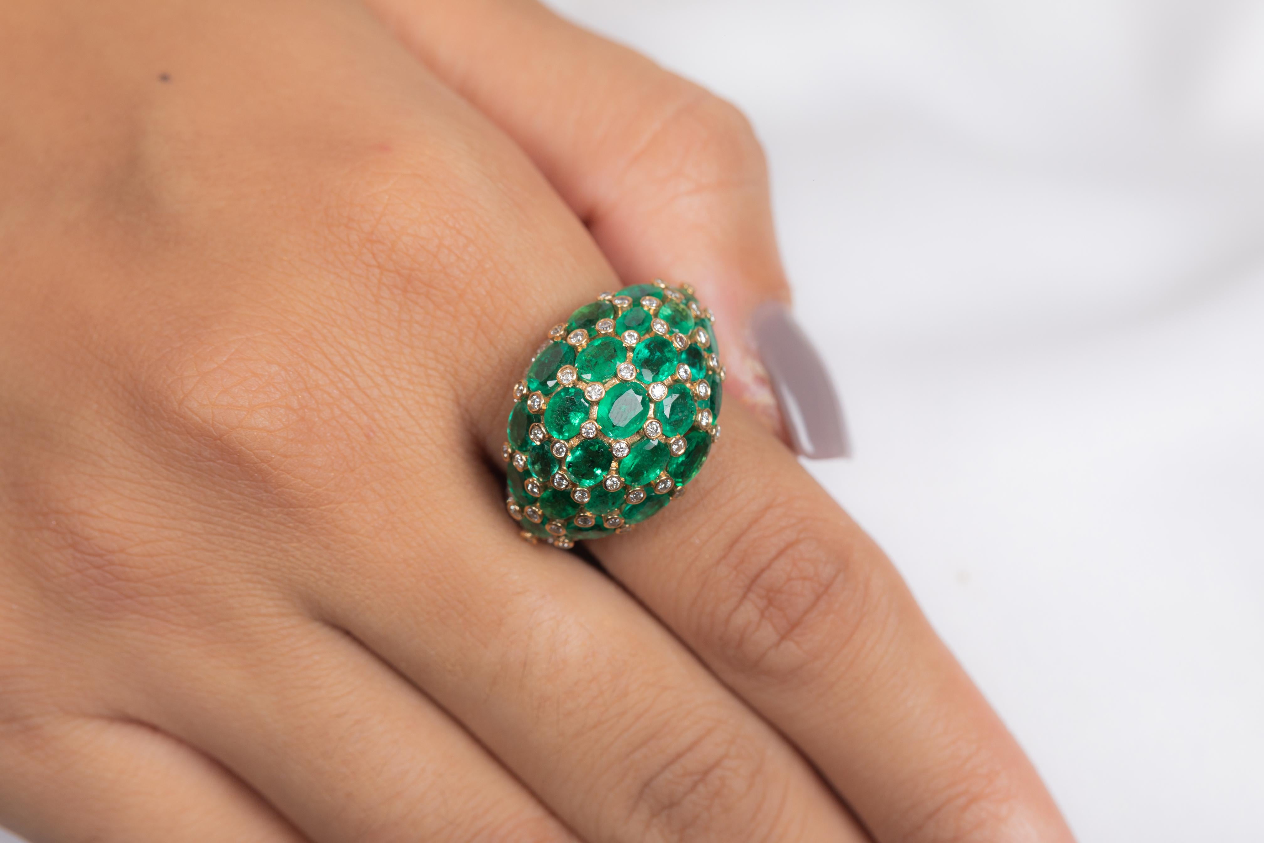 Emerald Diamond Cocktail Dome Ring in 18K Gold featuring natural emerald of 5.32 carats and diamonds of 1.51 carats. The gorgeous handcrafted ring goes with every style.
Emerald gemstone enhances the intellectual capacity of the person.
Designed