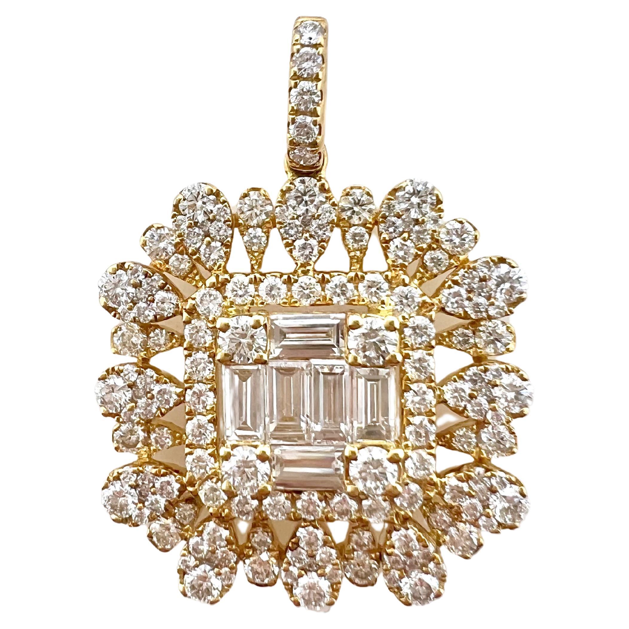 This gorgeous yellow gold diamond pendant will gain everyone's attention.  The unique design that borders the center baguette diamonds give it a contemporary look that can be worn smart casual or formally.  The round diamonds are strategically