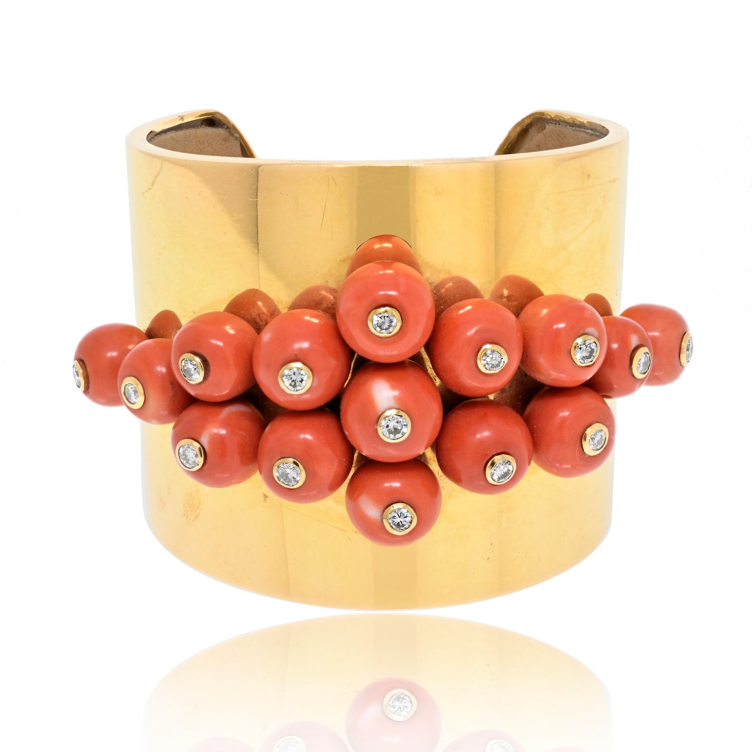 This beautiful cuff bangle is something that you won't find in the fine jewelry they make today. This cuff bangle bracelet circa 1960's is made of solid yellow gold, firmly encrusted with bead style coral, that is further studded with round cut