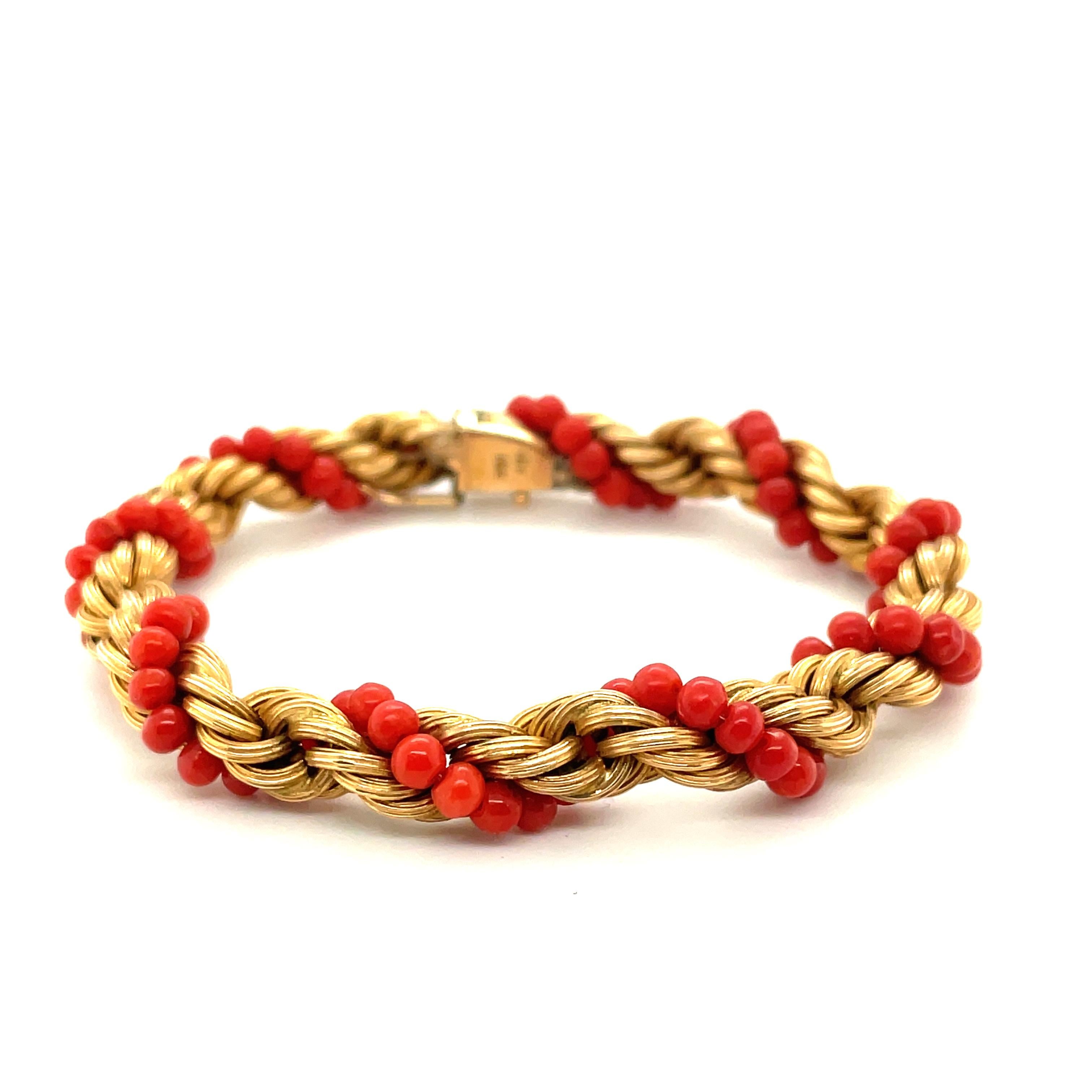 18K Yellow Gold Coral Bead Bracelet

The coral beads are strung on clear monofilament, twisted around the gold spiral components, and wound/tied at the ends. The bracelet is completed by a box clasp with figure-8 safety lock.

Dimensions: 6 1/4