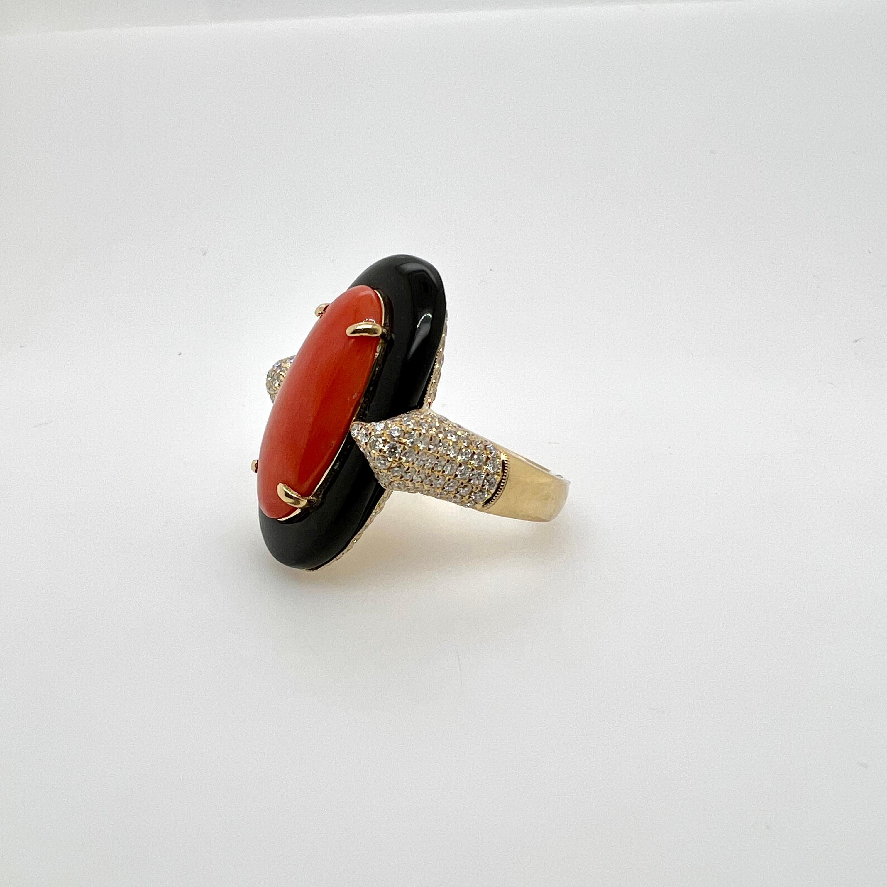 One of our iconic designs!  A truly remarkable design with our custom cut onyx and diamond setting to fit the elongated oval coral.  The meticulous workmanship is on full display and will definitely gain everyones attention!

Diamonds: 1.70 cts,