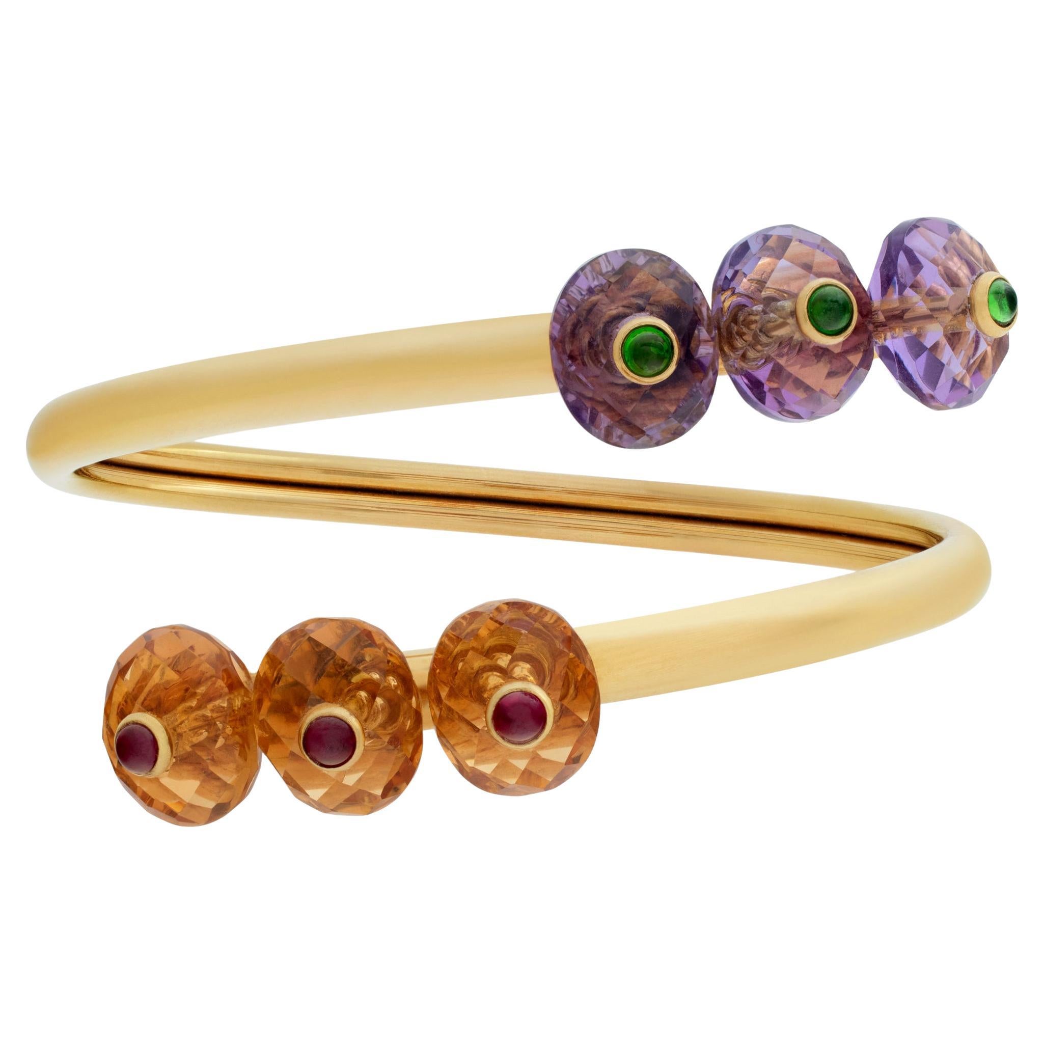 Bracelet croisé en or jaune 18K. Coupe ovale brillante facettée  Améthyste