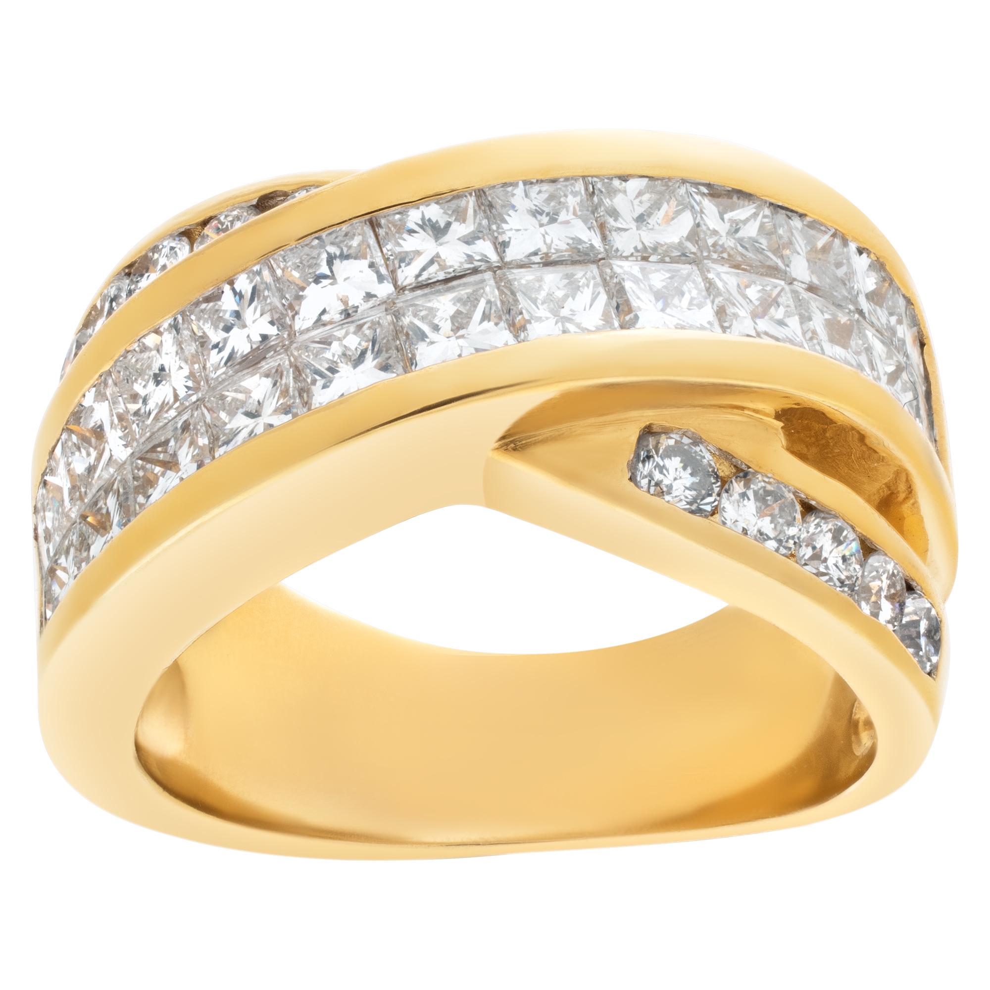 Stunning criss cross diamond ring with over 3 carats in princess cut and round cut diamonds set in 18k yellow gold. Front of the ring measures 11mm, shank 5.5mm. Size 7.5.

This Diamond ring is currently size 7.5 and some items can be sized up or